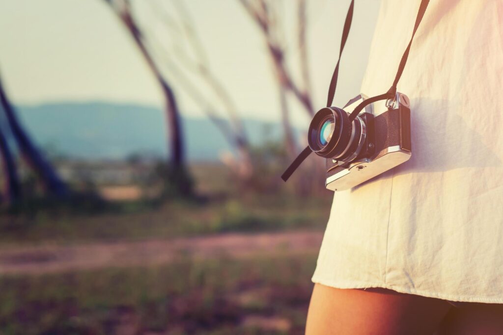 beautiful women photography standing hand holding retro camera Stock Free