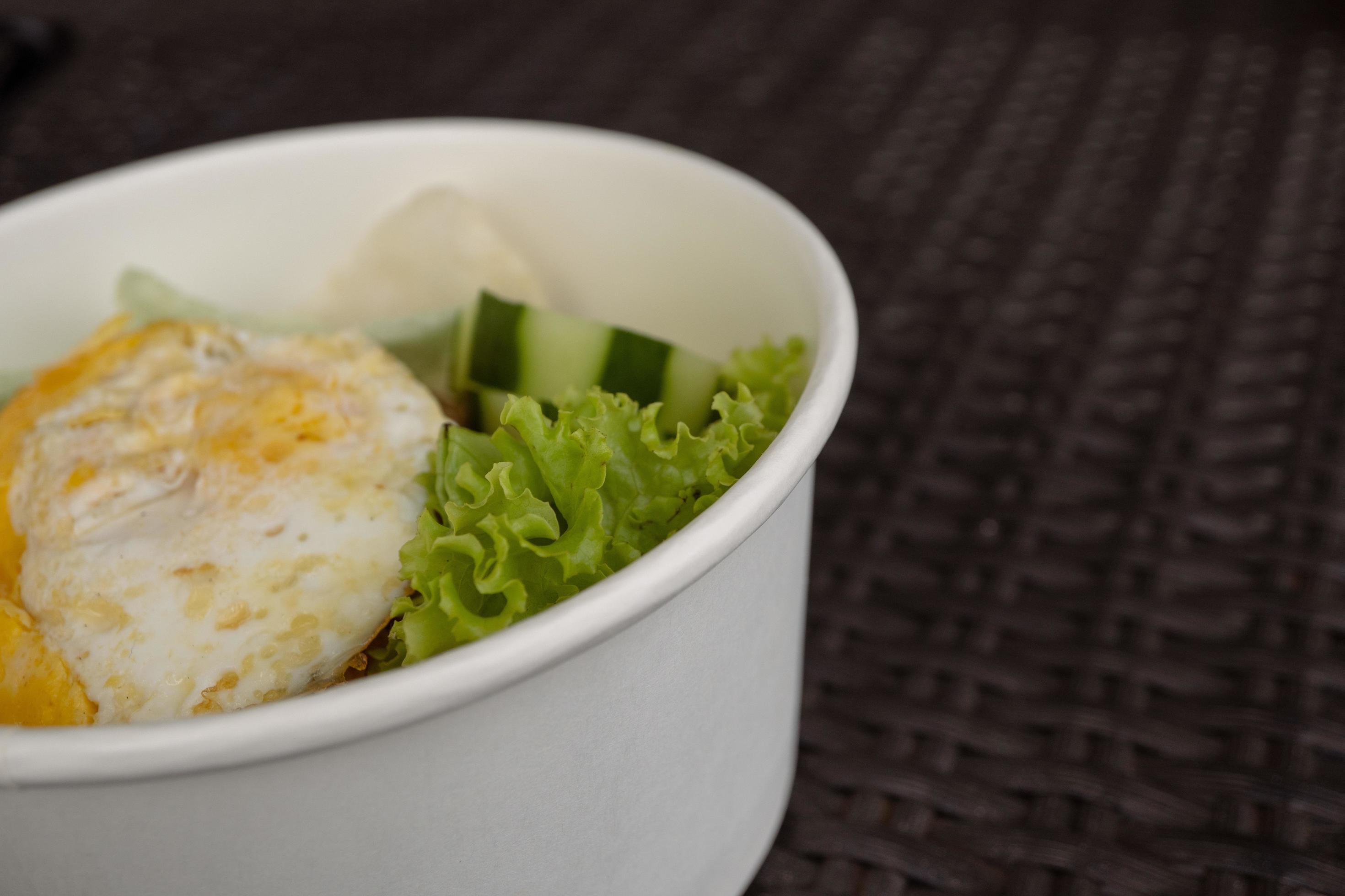 Close up photo fried rice with eggs and lettuce. The photo is suitable to use for traditional food background, poster and food content media. Stock Free