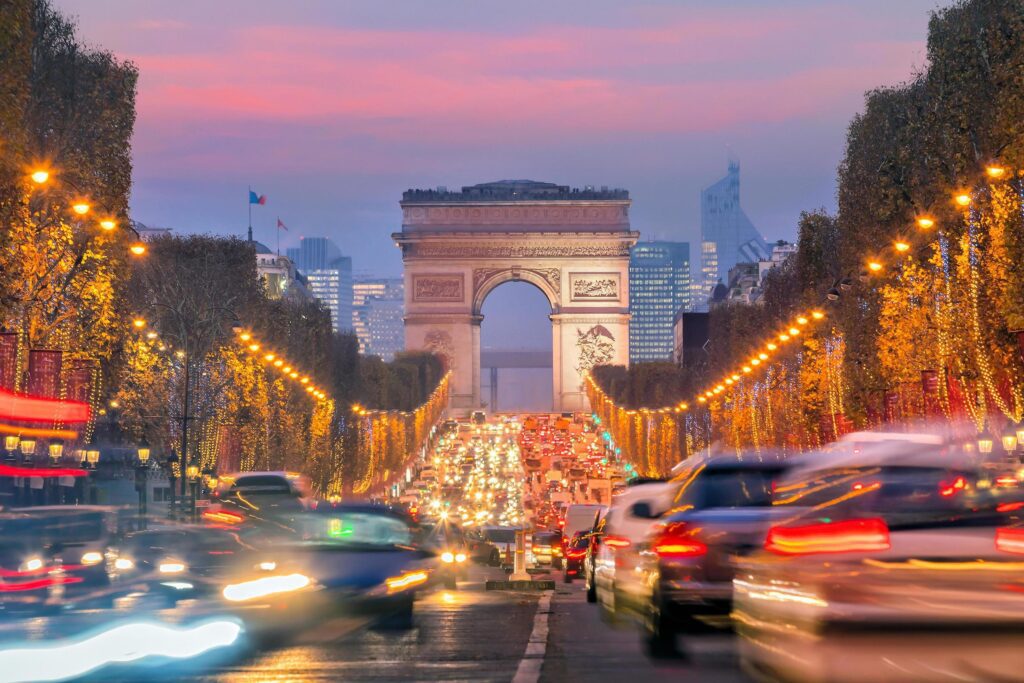 Famous Champs-Elysees and Arc de Triomphe at twilight in Paris Stock Free