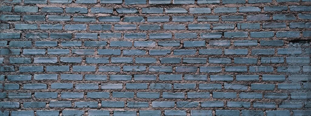 Vintage brick wall with horizontal structure. Panoramic web banner or wallpaper with copy space. Stock Free