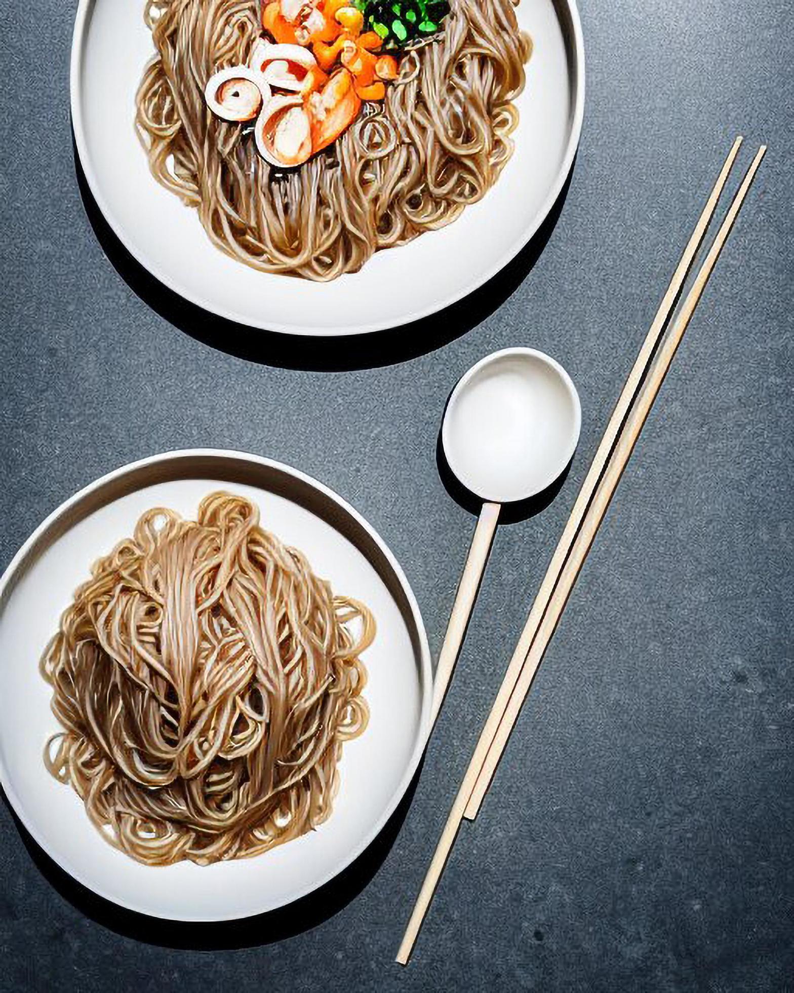 Delicious noodles. Fast food meal with appetizing pasta and chopsticks. Stock Free