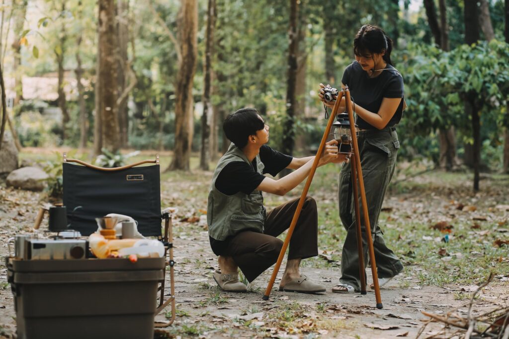 Asian couple sweet in tent inside on they camping trip, traveller relax and sleep togather in out door and camping trip Stock Free