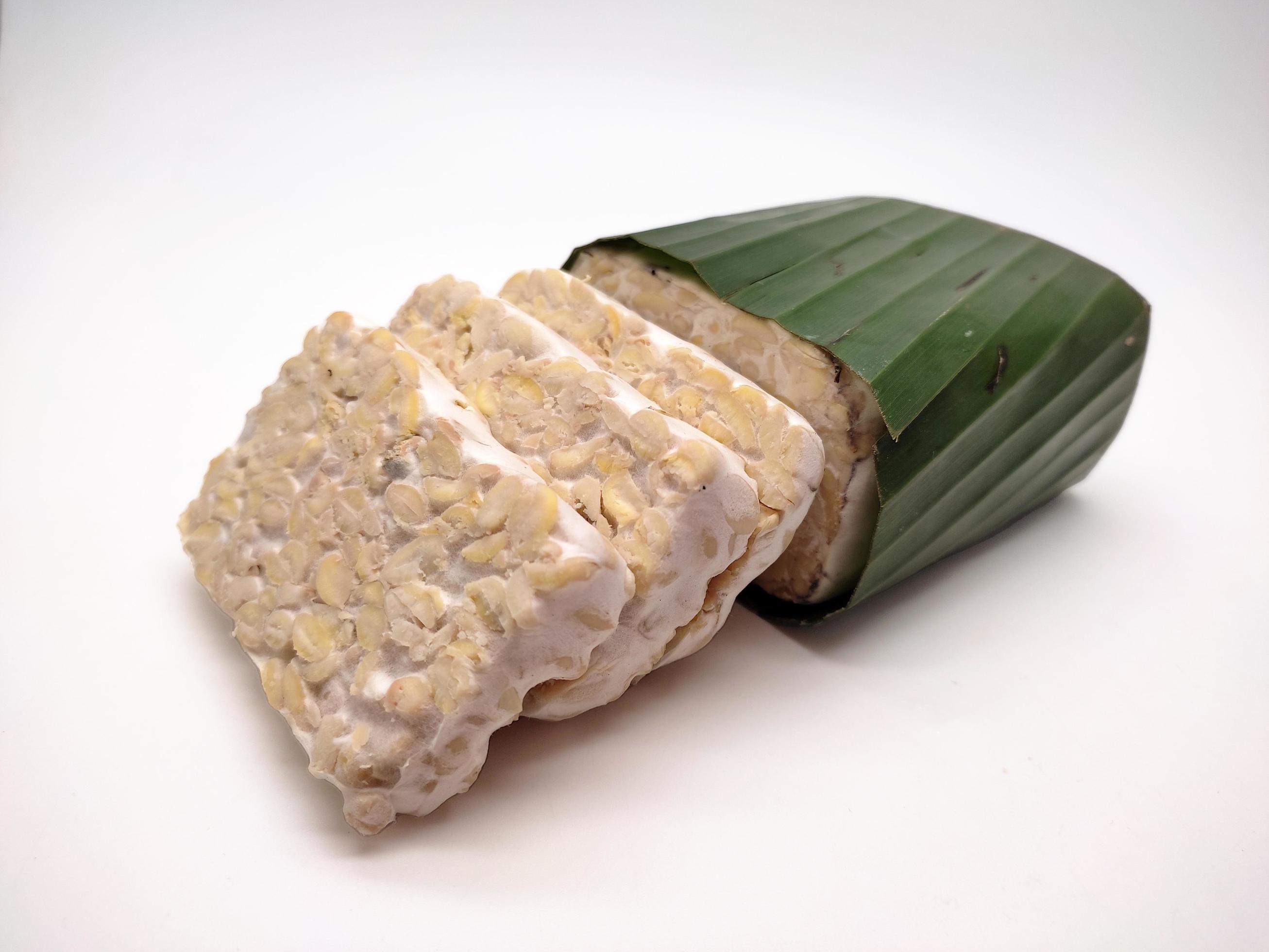 Raw Tempeh or Tempe, Indonesian traditional food, made from fermented soybeans, On White Background. Stock Free