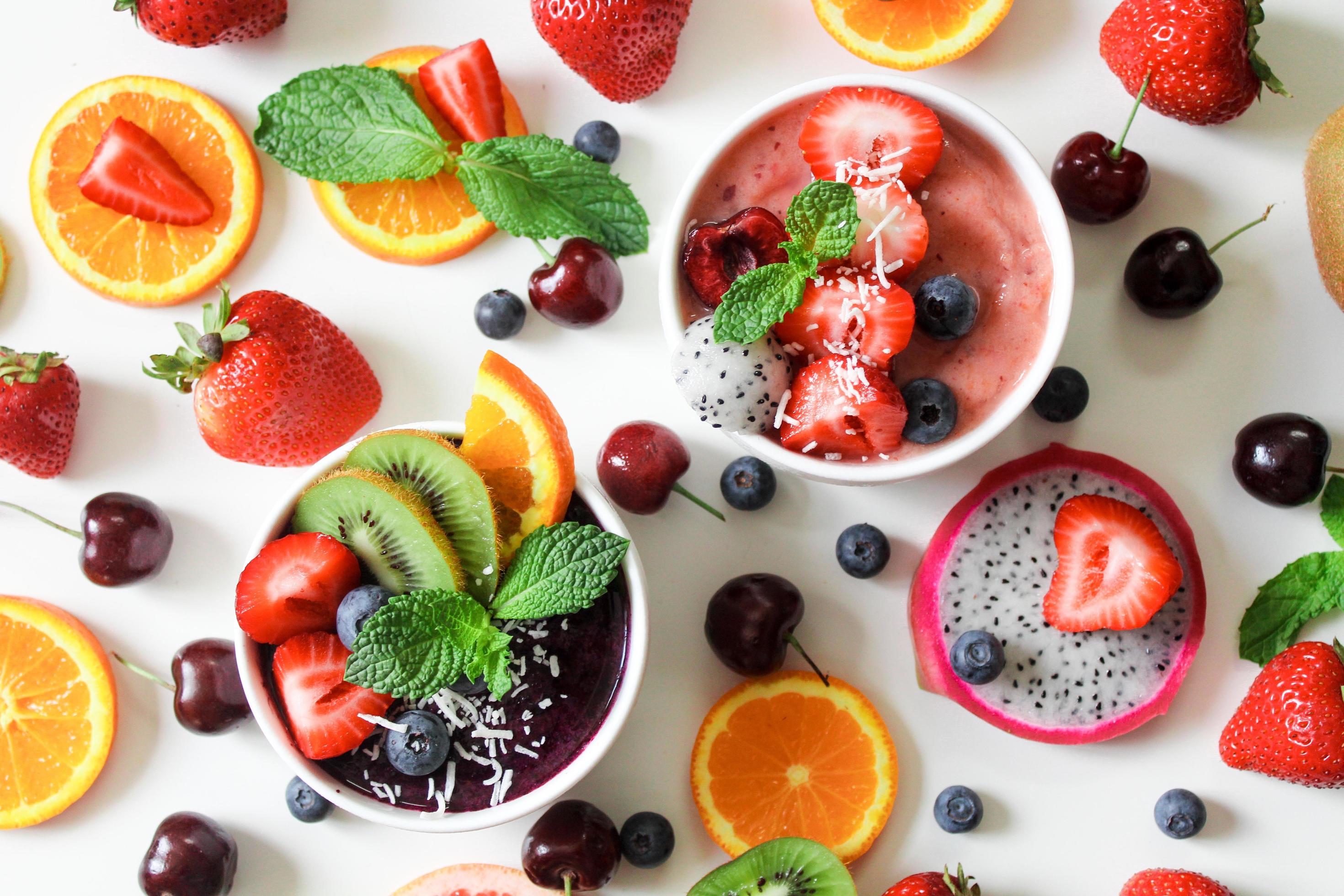 Fruits and smoothie on white surface Stock Free