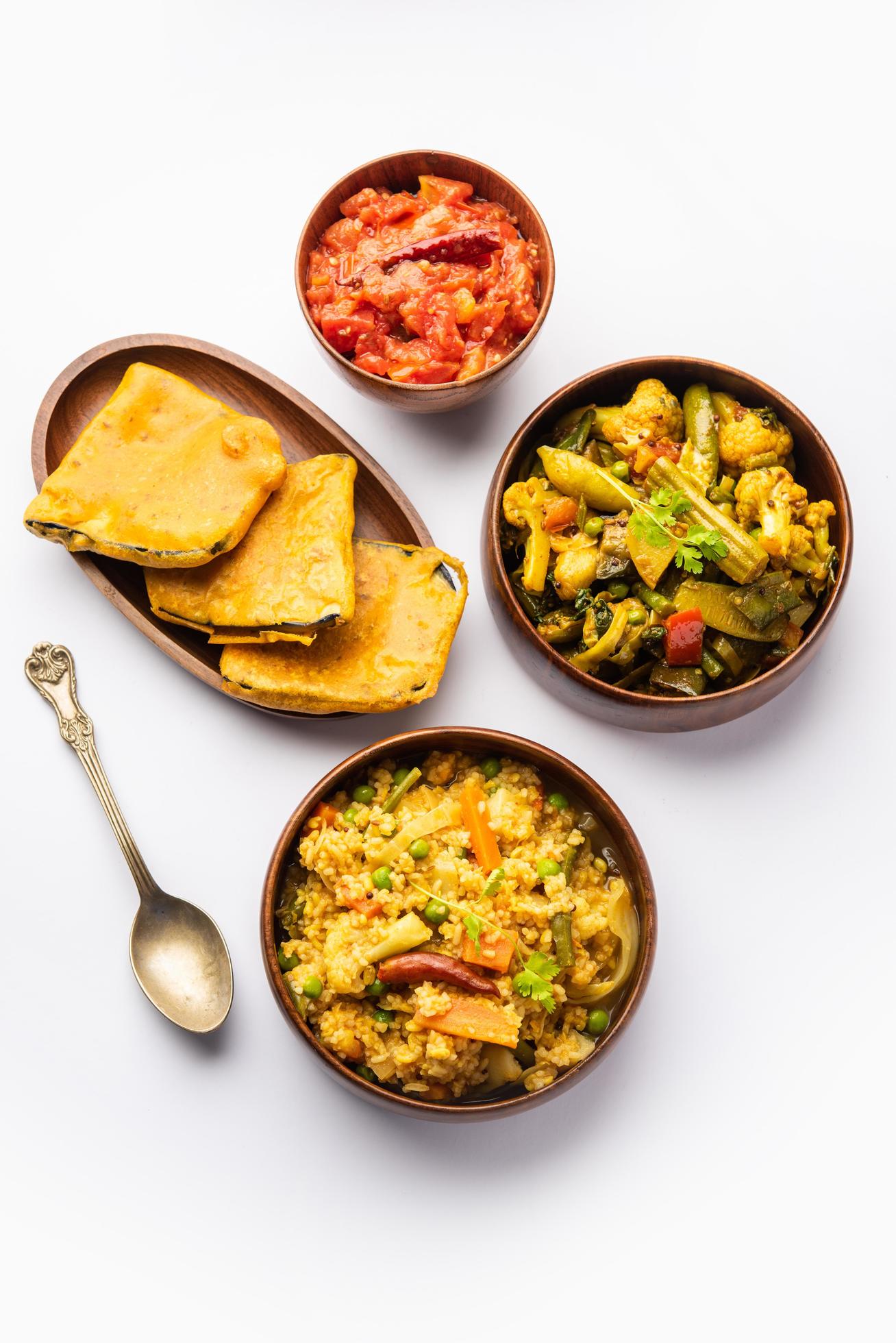 Bengali Bhog food for Indian Hindu Durga Puja or pooja festival. Khichadi, labra, tomato chutney Stock Free