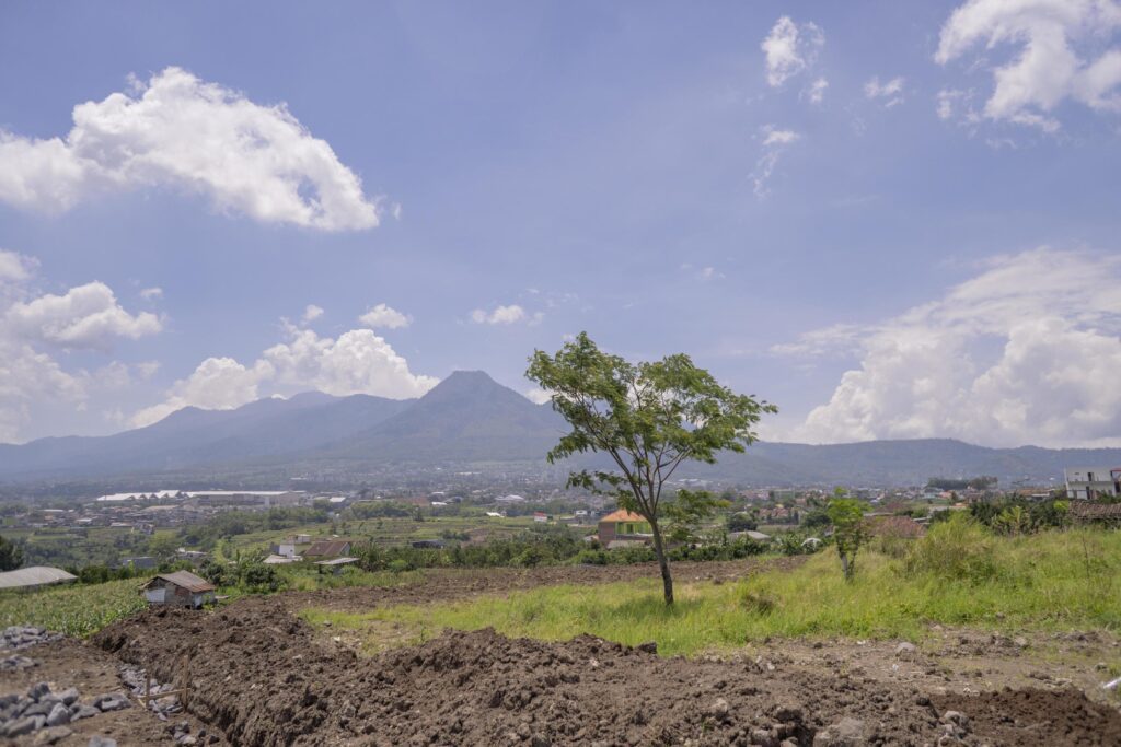 Landscape scene mountain tree and blue sky with cloudy. The photo is suitable to use for nature background, environment poster and nature content media. Stock Free