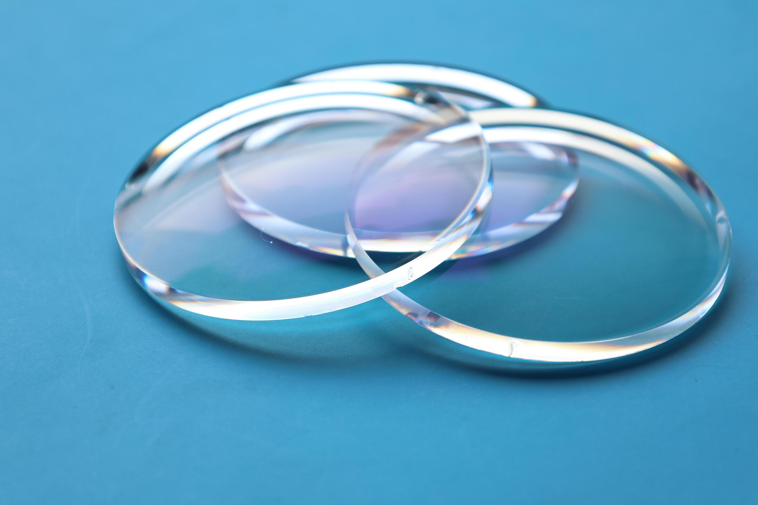 Eyeglasses lens production industry, close-up eyeglasses lenses, eyeglasses lenses, eyeglasses lenses, eyeglasses store business concept Stock Free