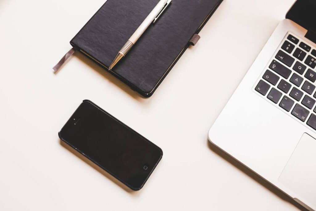 Black iPhone, MacBook & Notepad Stock Free