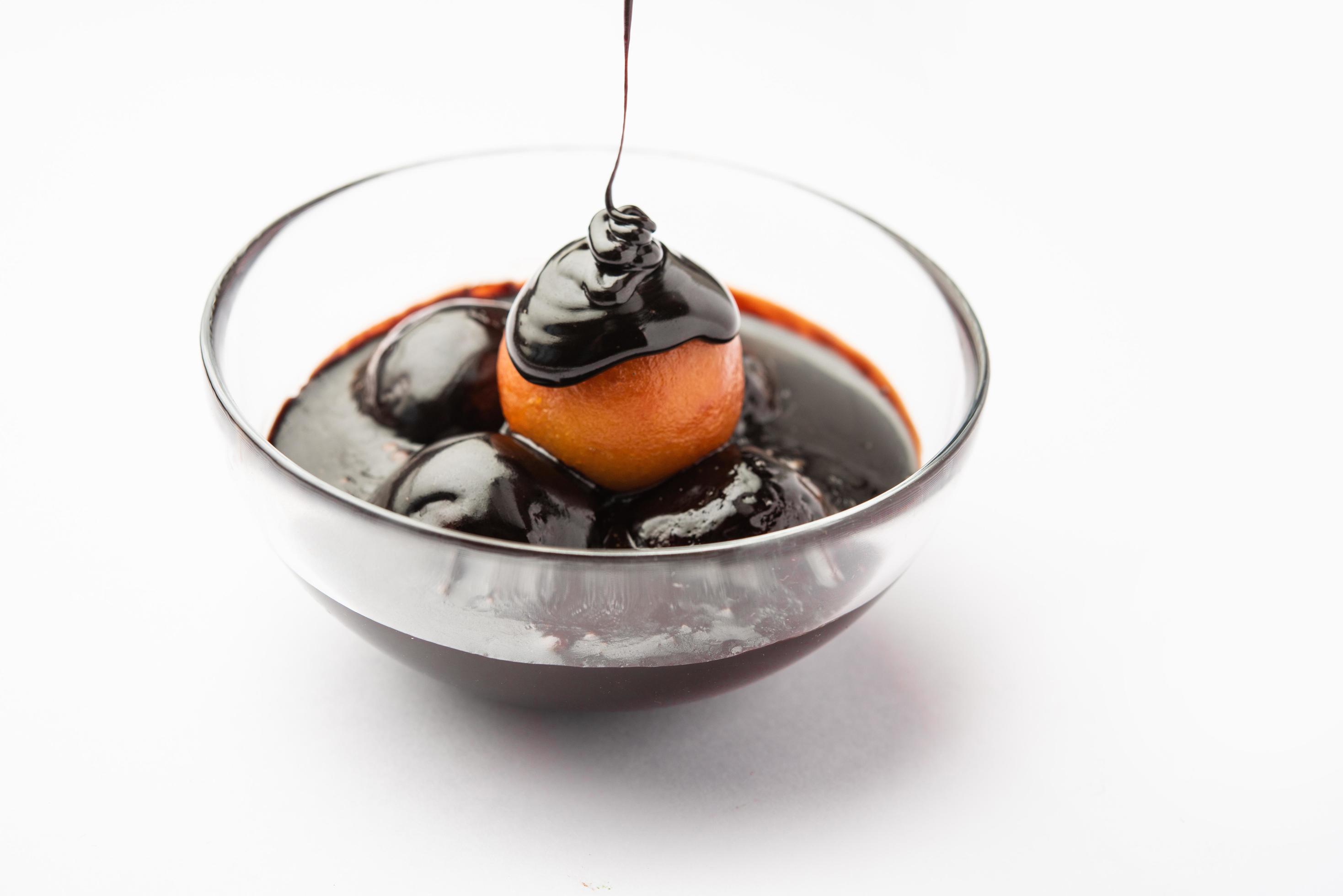 Chocolate dipped gulab jamun, indian creative fusion dessert food Stock Free