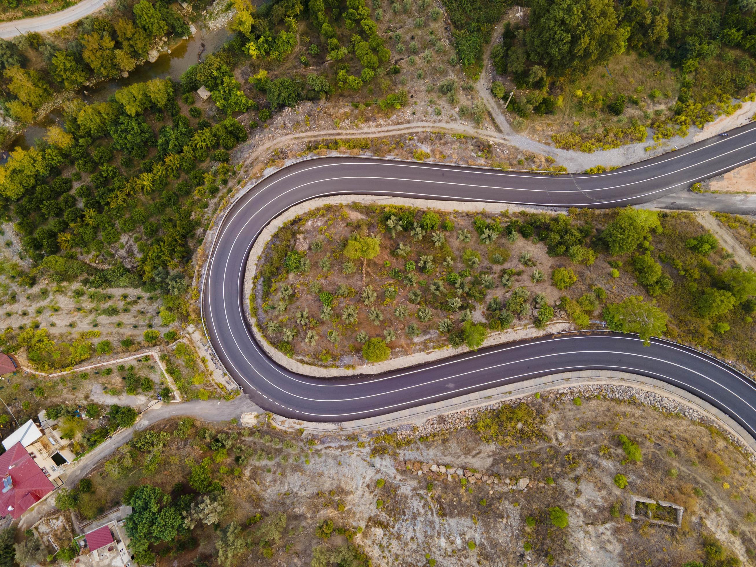 aerial valley and road, Top view, amazing nature background. sunset Flying drone, seascape Stock Free