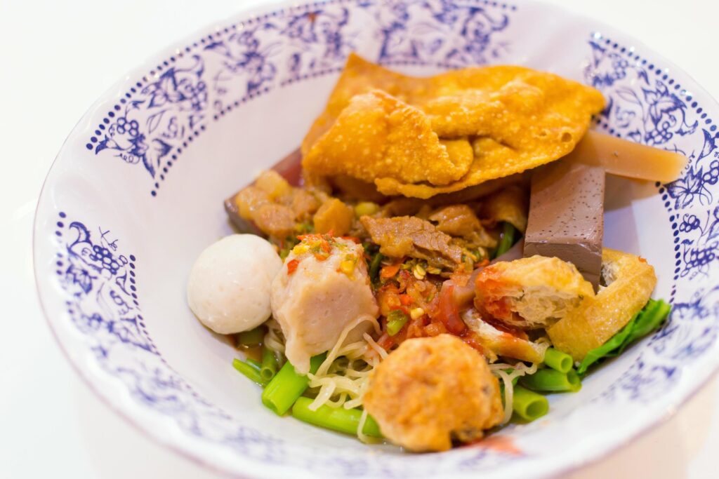 Fish ball noodles soup with red sauce Yen Ta Fo is a street food in Thailand Stock Free