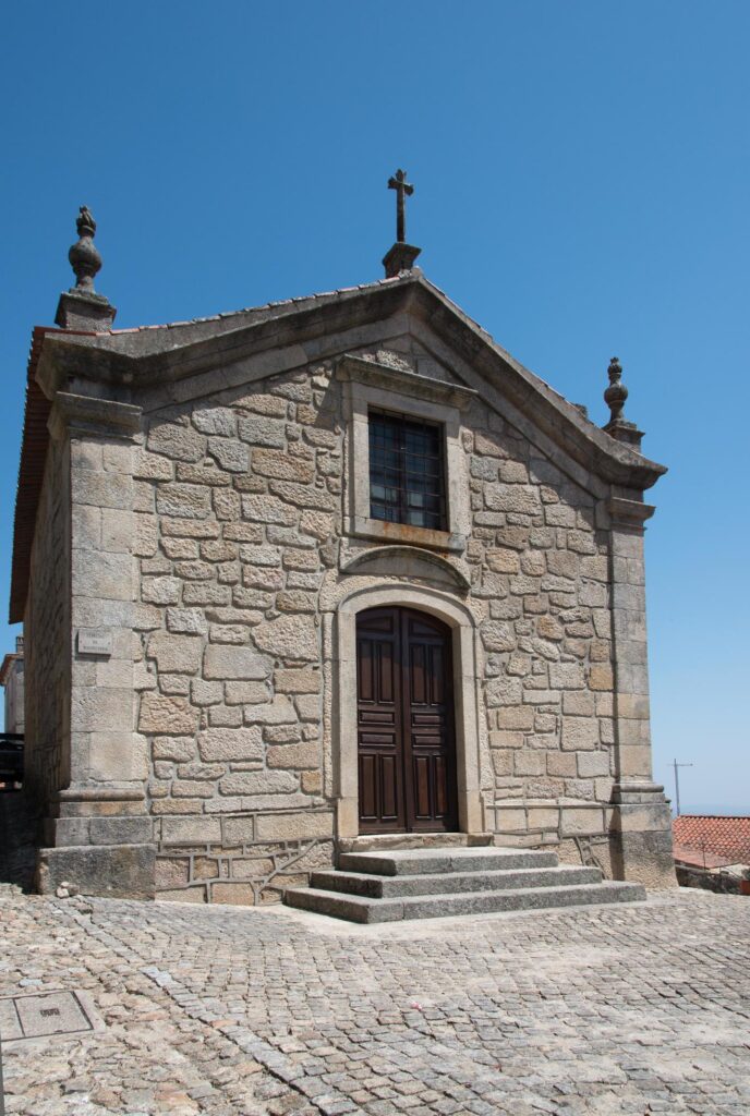 Front view of Chapel of the Lord of Mercy, beautiful religious building made of stone. Castelo Novo, Portugal Stock Free