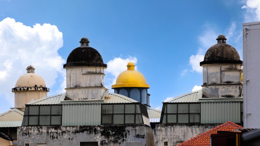 Group of four top domes on colorful old traditional mosque. Stock Free