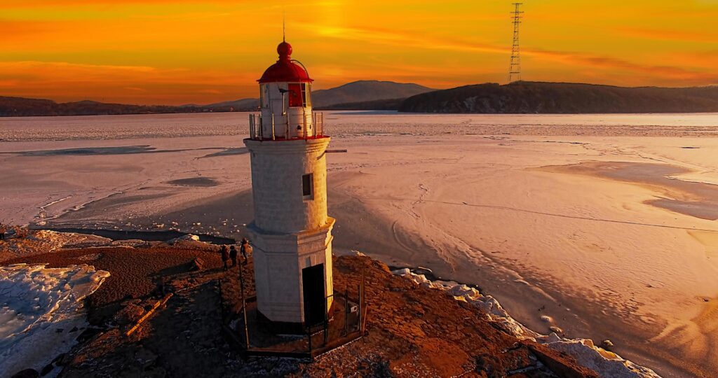 lighthouse in the background of the sunset. Vladivostok, Russia Stock Free