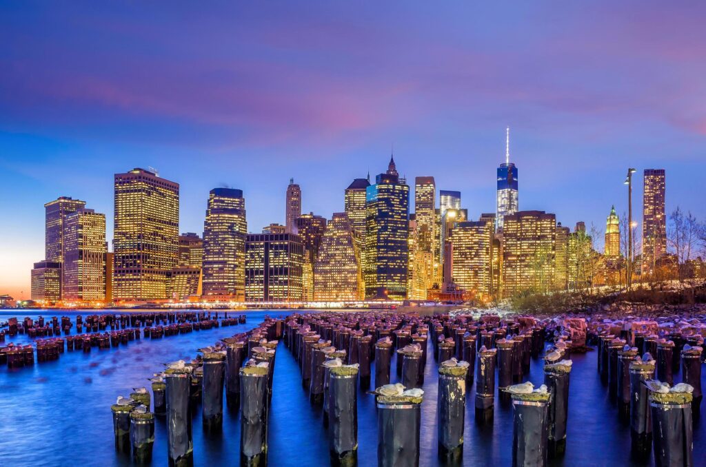 Manhattan Skyline with the One World Trade Center building at twilight Stock Free