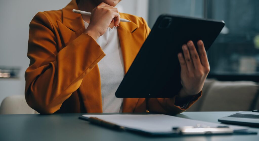 Portrait of a successful business woman using digital tablet Stock Free