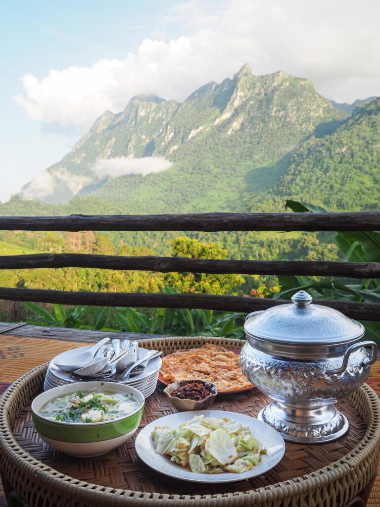 Side view of Thai foods traditionally dinner with mountains background Stock Free