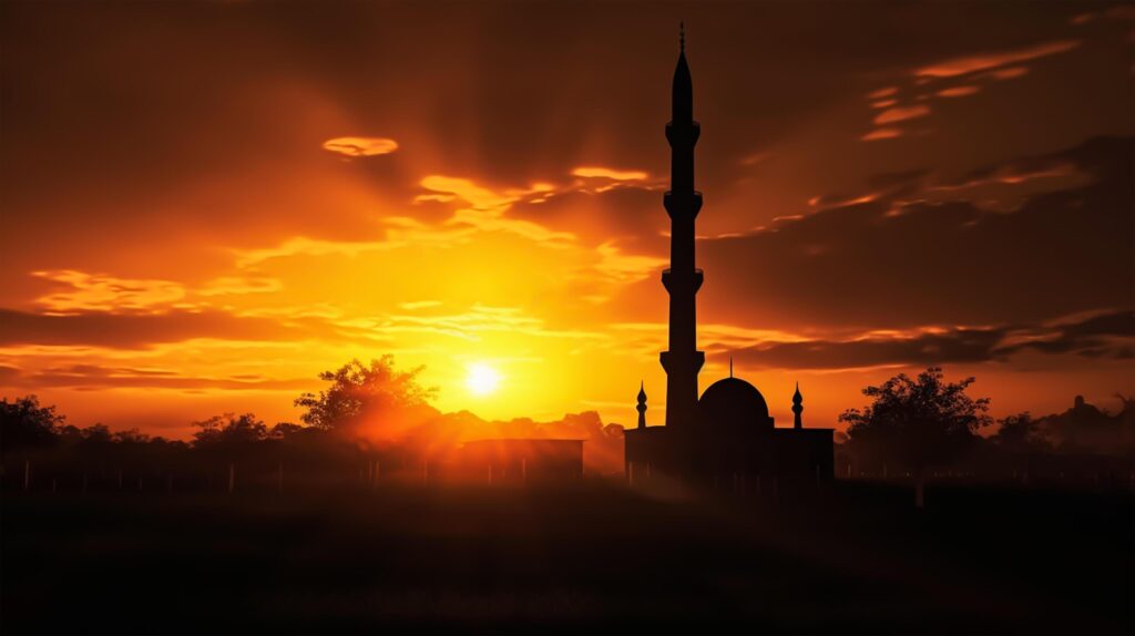 silhouette of muslim mosque minaret5 big sunset view in background. Stock Free