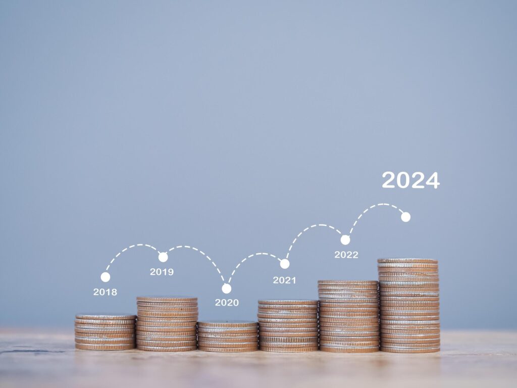 Stack of coins with arrow rising. The concept of business growth, Financial investment, Market stock, Profit return, Dividend and Business fund in year 2024 Stock Free