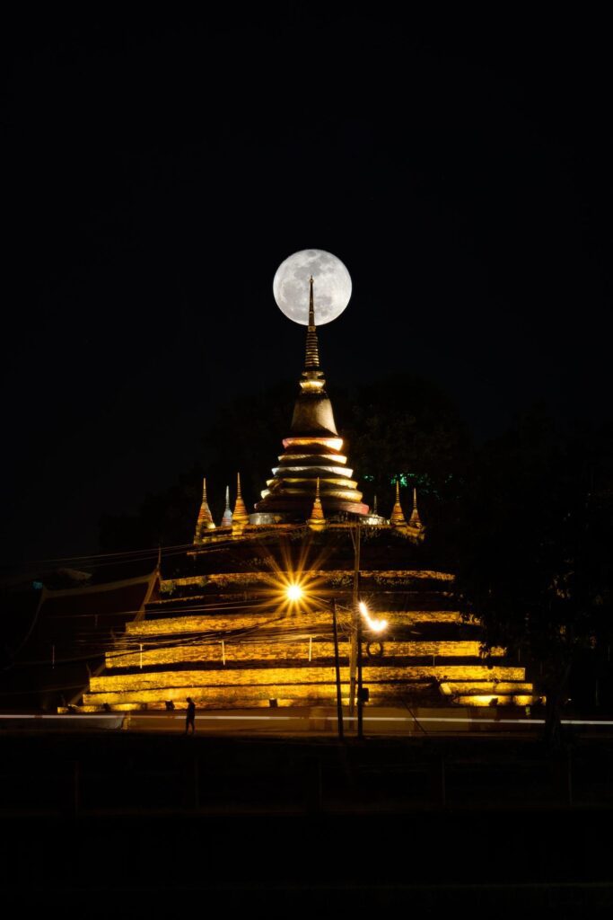 Super moon in night sky and silhouette of ancient pagoda is named Wat Ratchaburana, Phitsanulok in Thailand Stock Free