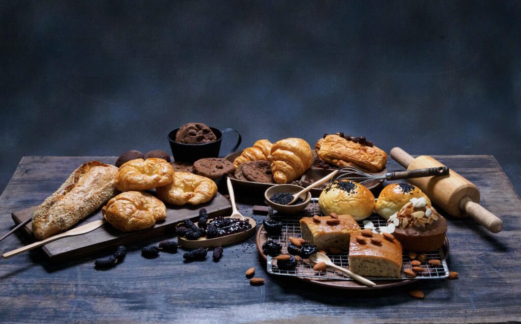 top view fresh bread brown raisins sesame bakery made from wheat flour food homemade suitable for healthy eating on wooden table floor black rustic dark background Stock Free