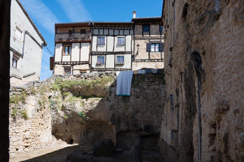 Traditional architecture at Frias, Merindades. Ancient houses with wood details. No people, Burgos, Spain Stock Free