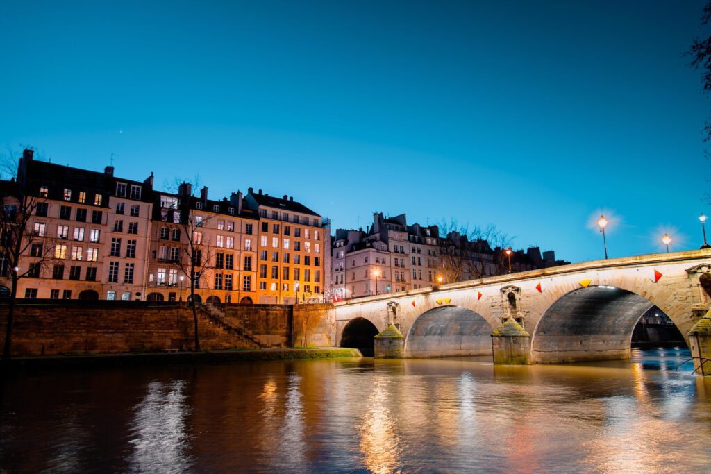 Twilight scene from Paris Seine River with fantastic colors during sunset. Stock Free