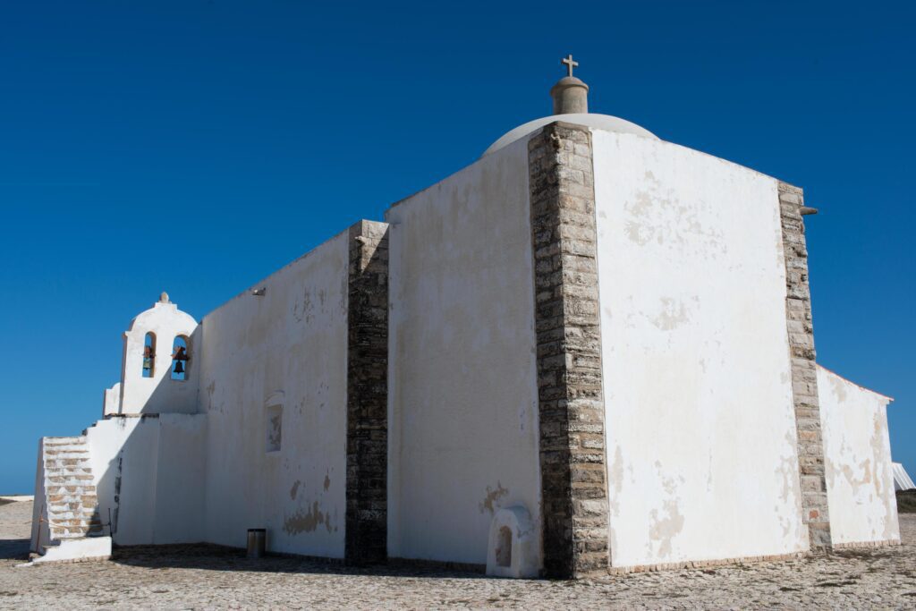 White building inside the Fortress at Sagres. Church of Our lady of Grace. Portugal Stock Free