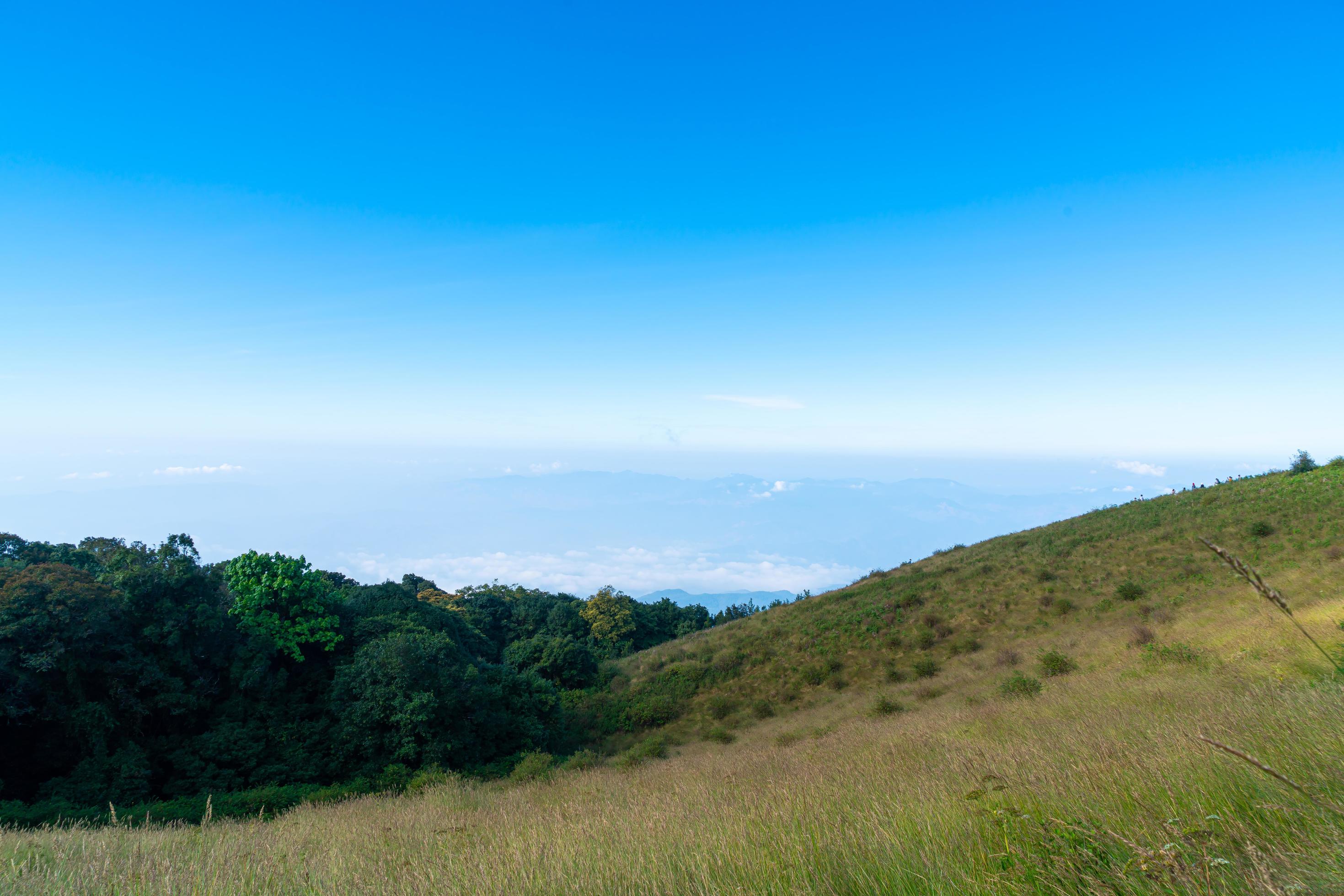 Beautiful mountain layer with clouds and blue sky at Kew Mae Pan Nature Trail in Chiang Mai, Thailand Stock Free