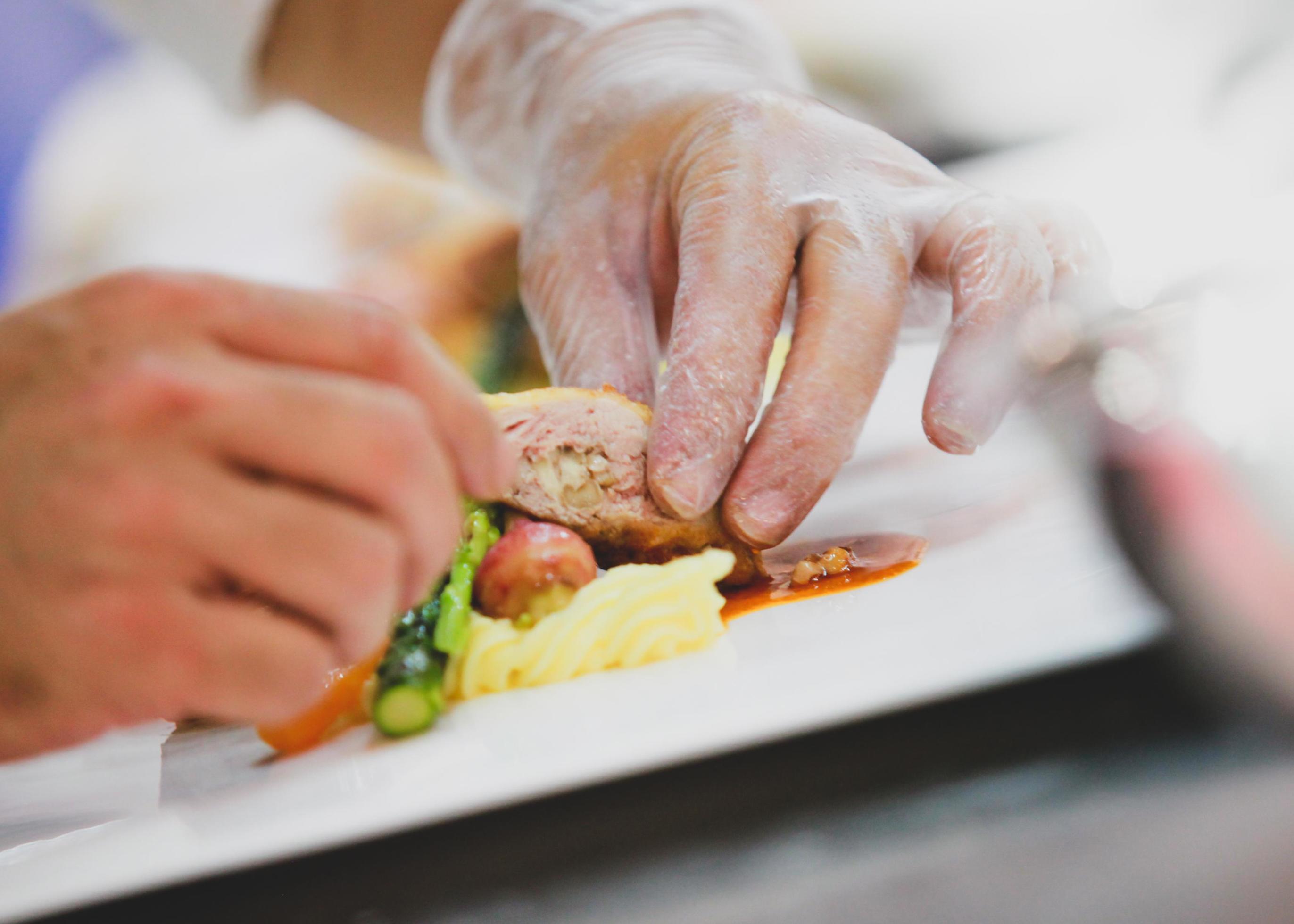 Chef preparing food in the kitchen, chef cooking, Chef decorating dish Stock Free