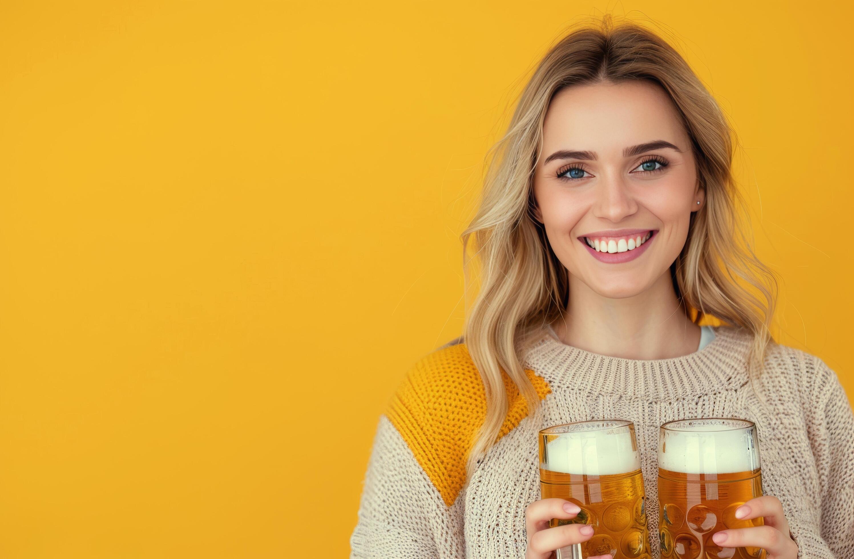 Young Woman Smiling With Beer Mugs Against Bright Yellow Background Stock Free