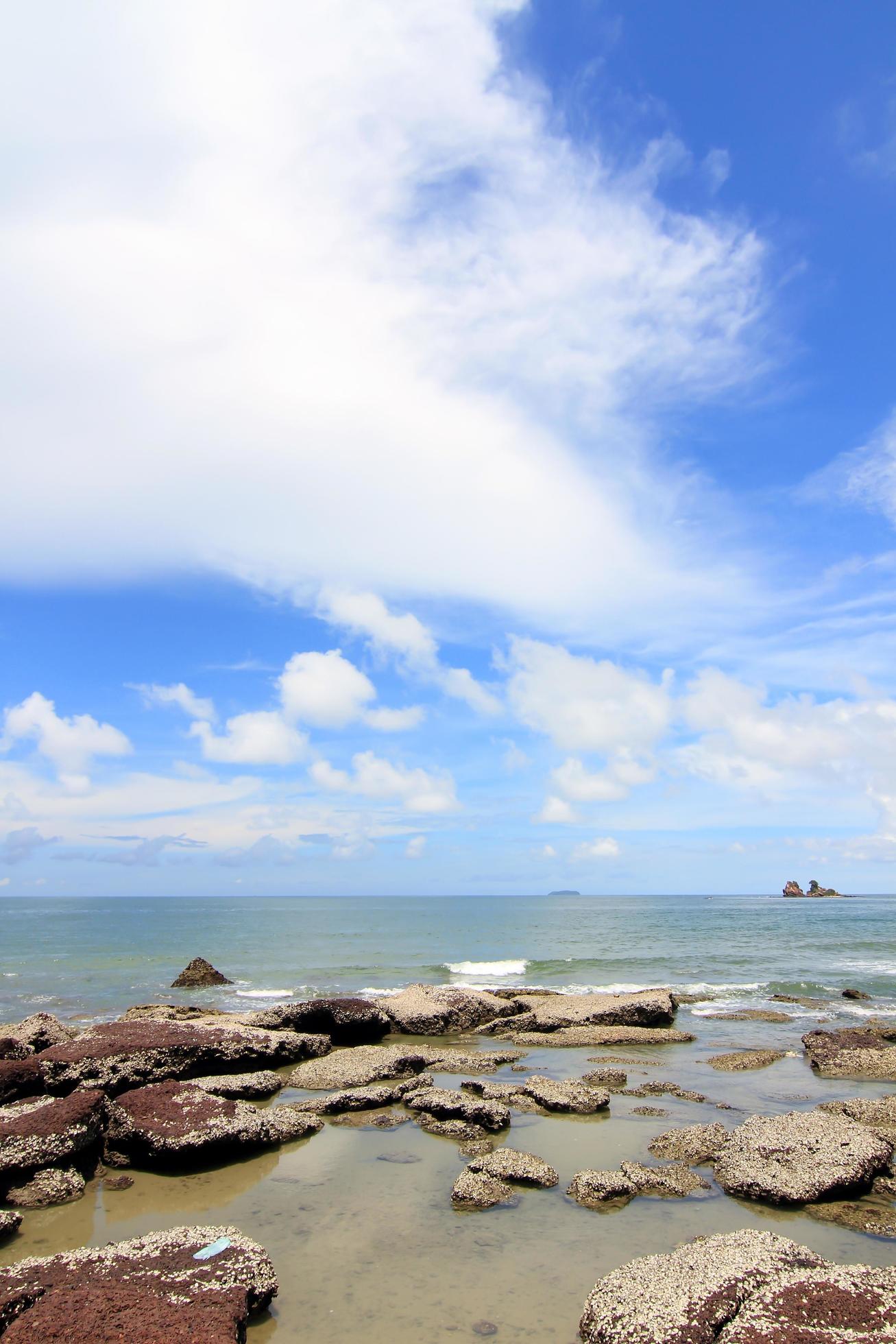 Tropical beach with stone and sky Stock Free