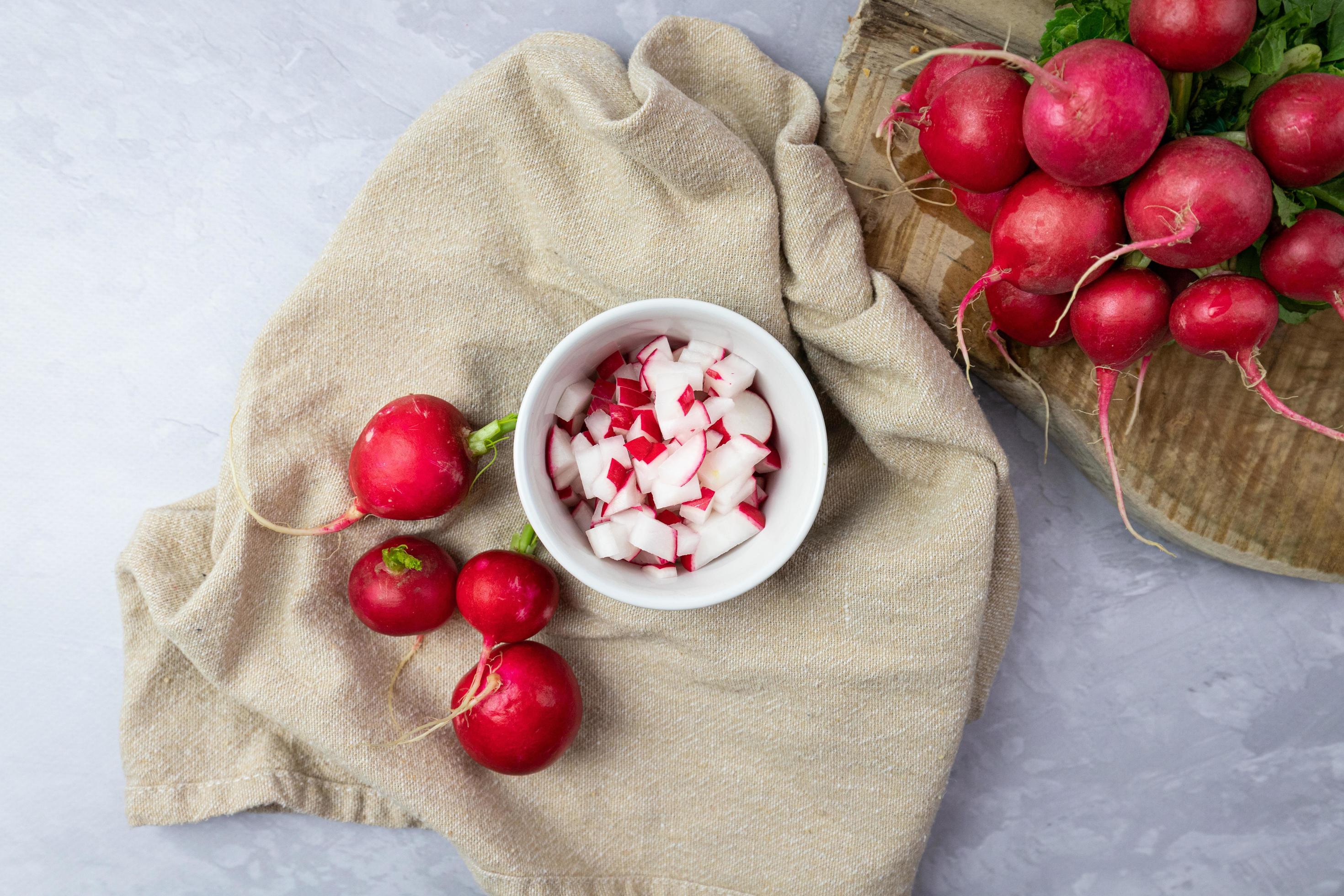 Chopped radish in a bowl. Preparation of ingredients for food. Top view. Stock Free