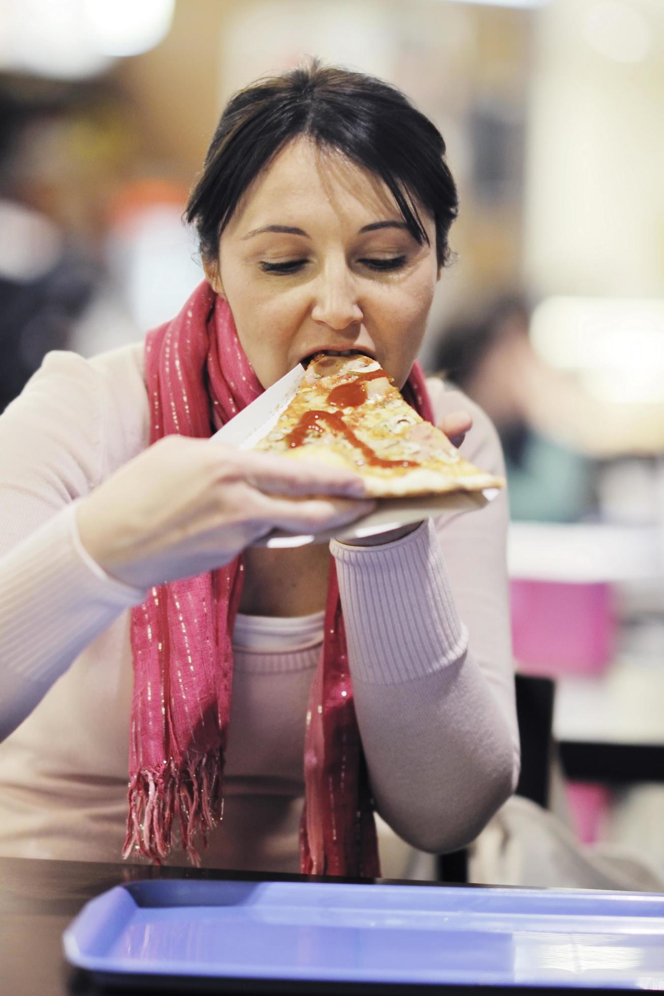 woman eat pizza food at restaurant Stock Free