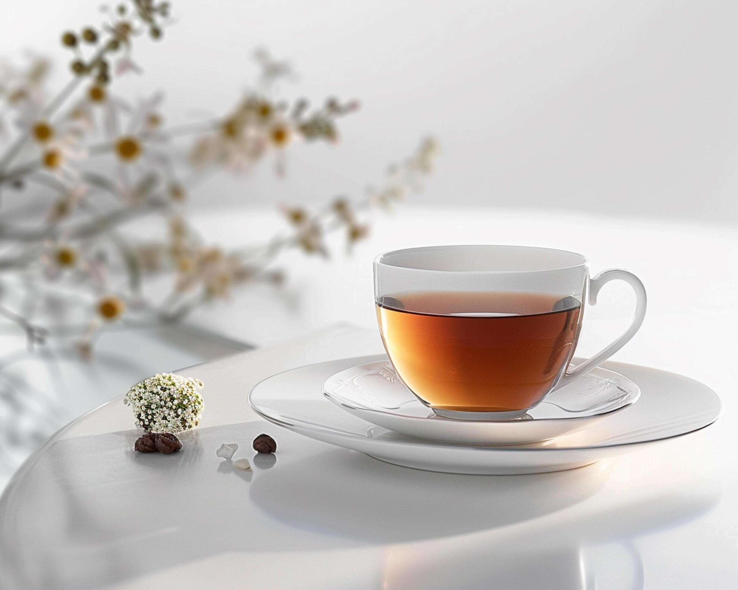 a cup of tea sits on a saucer Stock Free