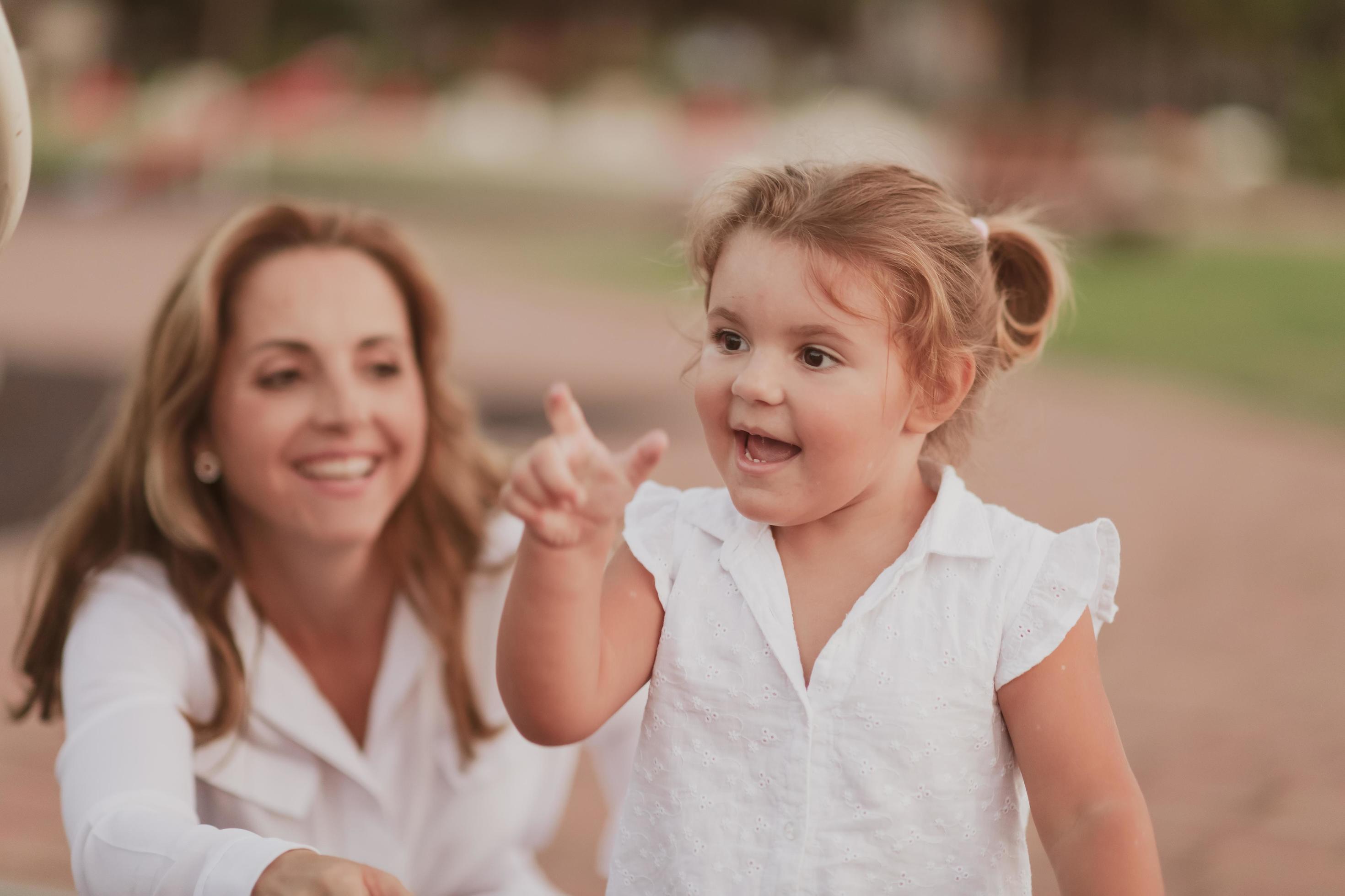 An elderly woman in casual clothes with his daughter spends time together in the park on vacation. Family time. Selective focus Stock Free