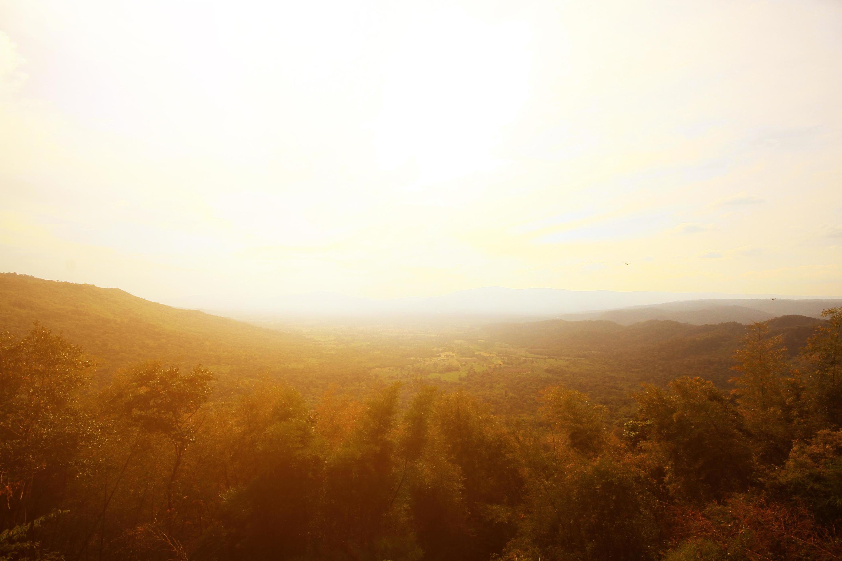 Beautiful landscape layers of mountain and Misty on hill valley in golden twilight of sunset at Thailand Stock Free