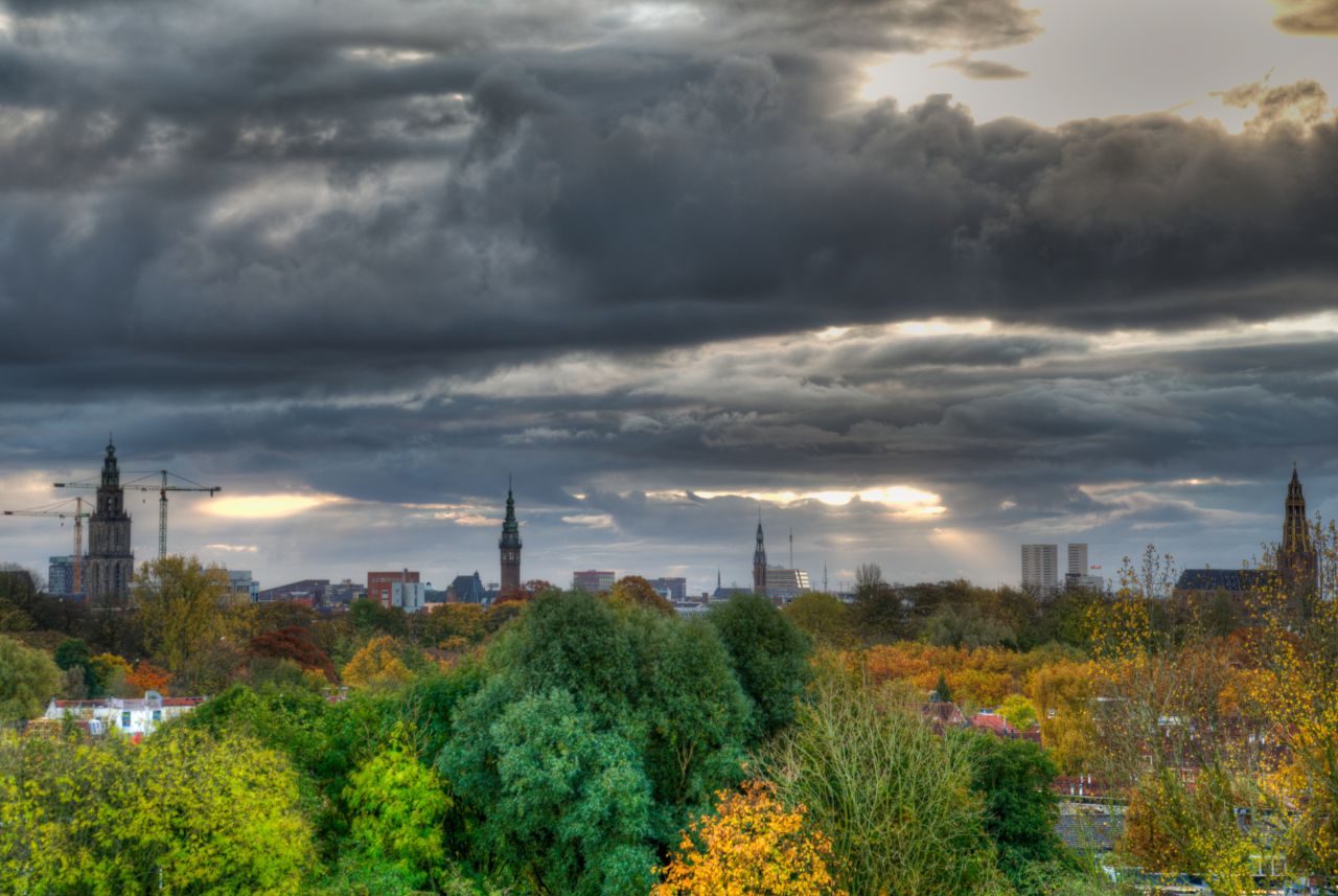 Colorful city covered in clouds Stock Free