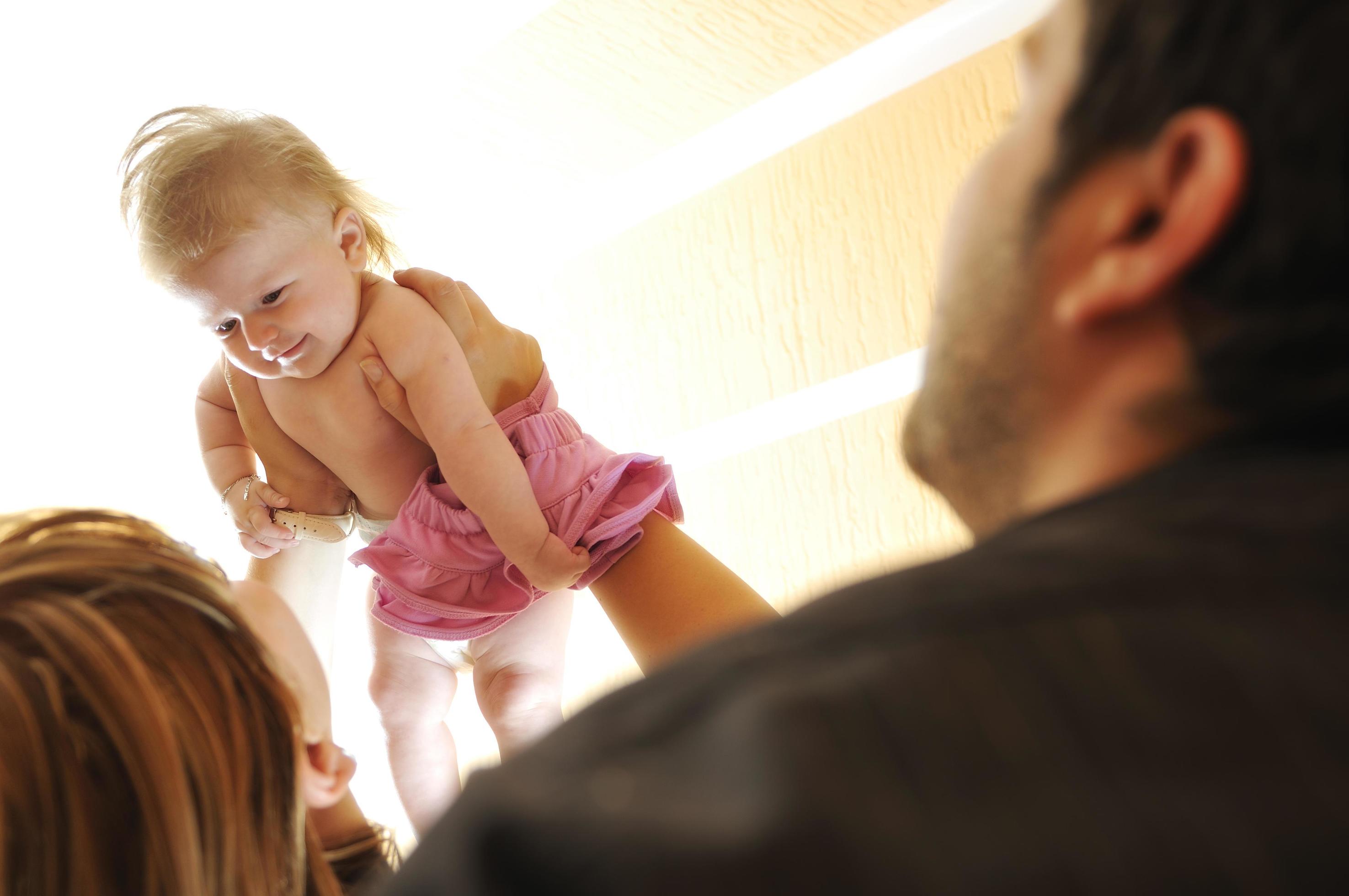 portrait of young family with cute little babby Stock Free