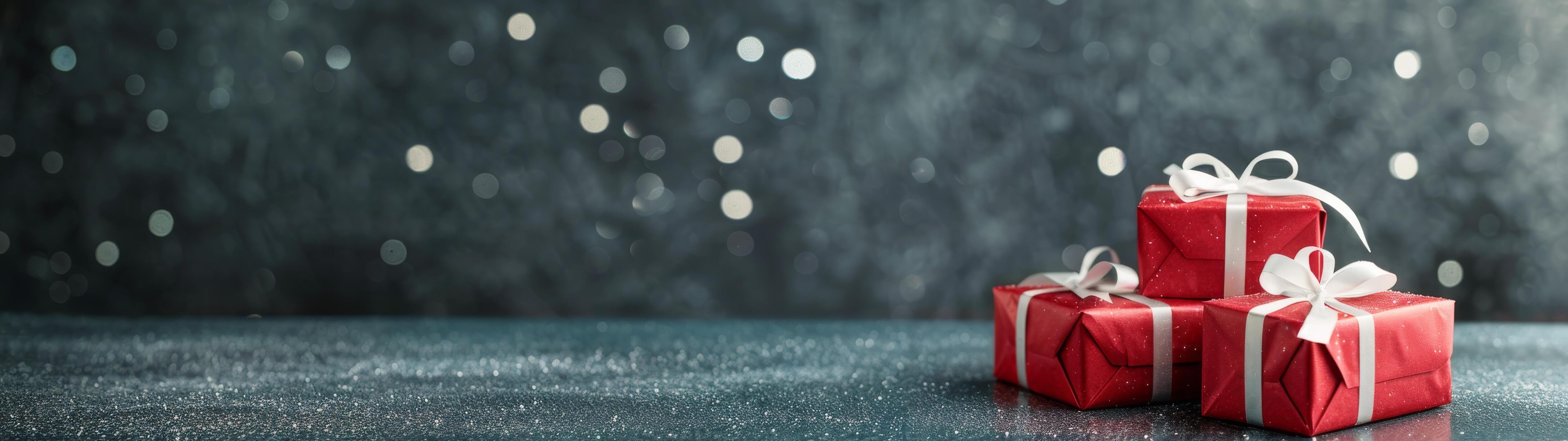 Festive Red Presents Wrapped With Silver Ribbon and Bokeh Background Stock Free