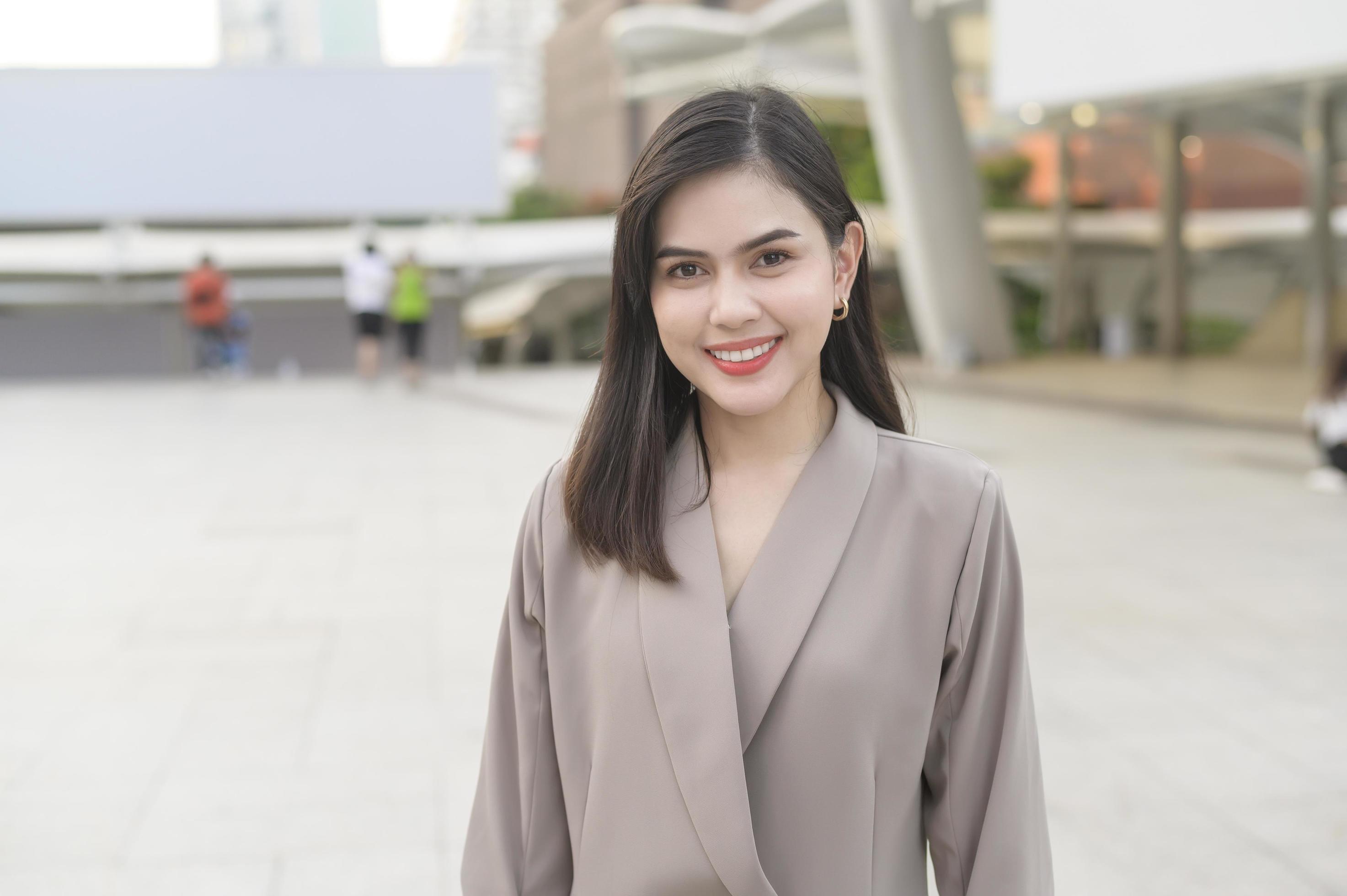 A portrait of beautiful smiling Businesswoman in modern City , people lifestyle concept Stock Free