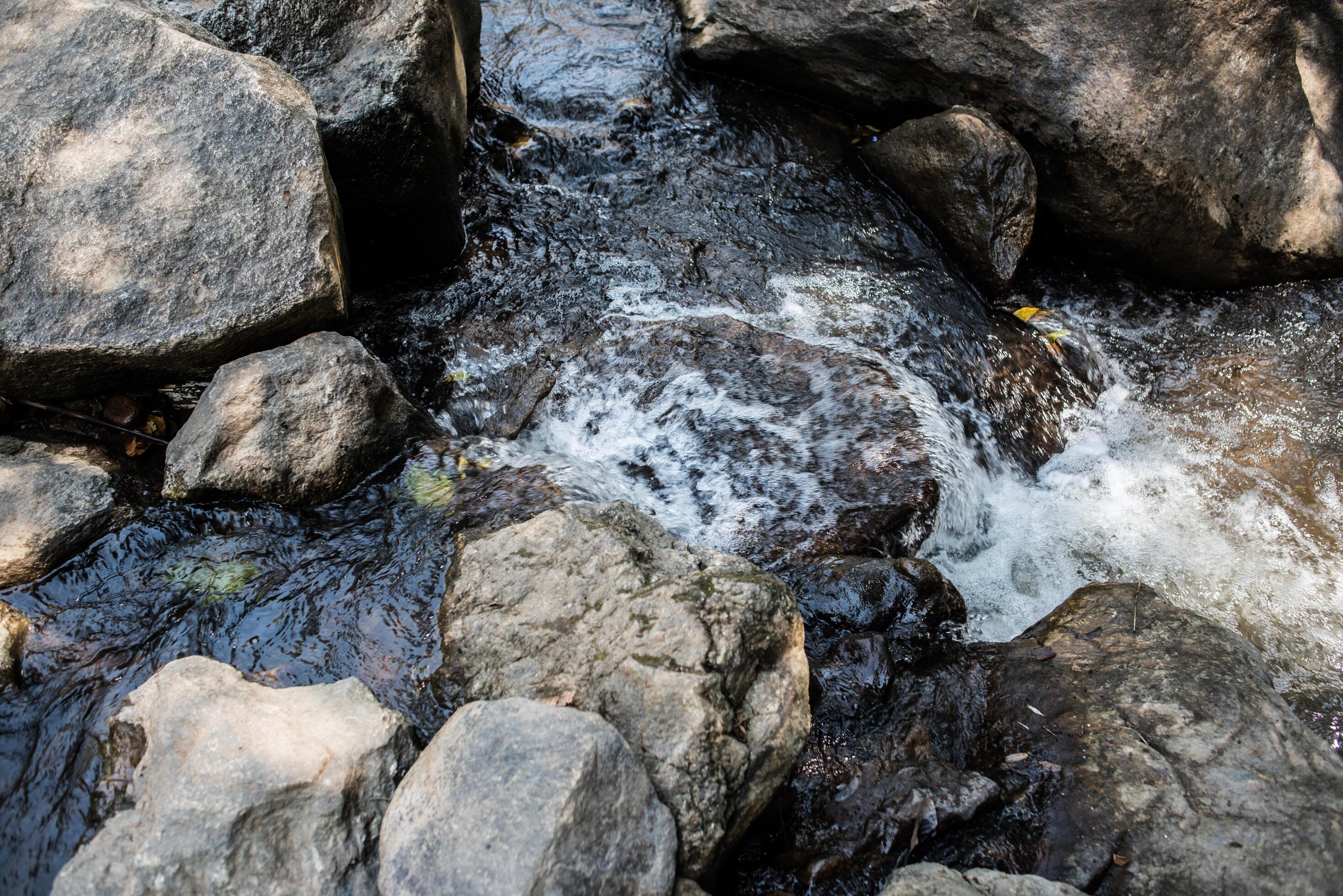 Waterfall in the nature and stone background Stock Free