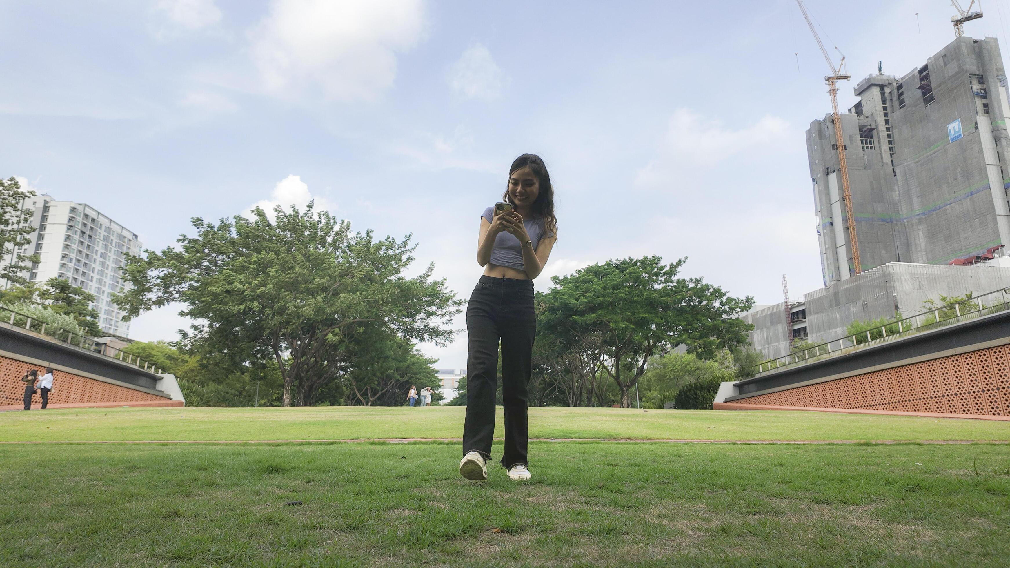 Asian women do freestyle hip hop and breakdancing in a public space in the middle of the city. With a cheerful and happy attitude Stock Free