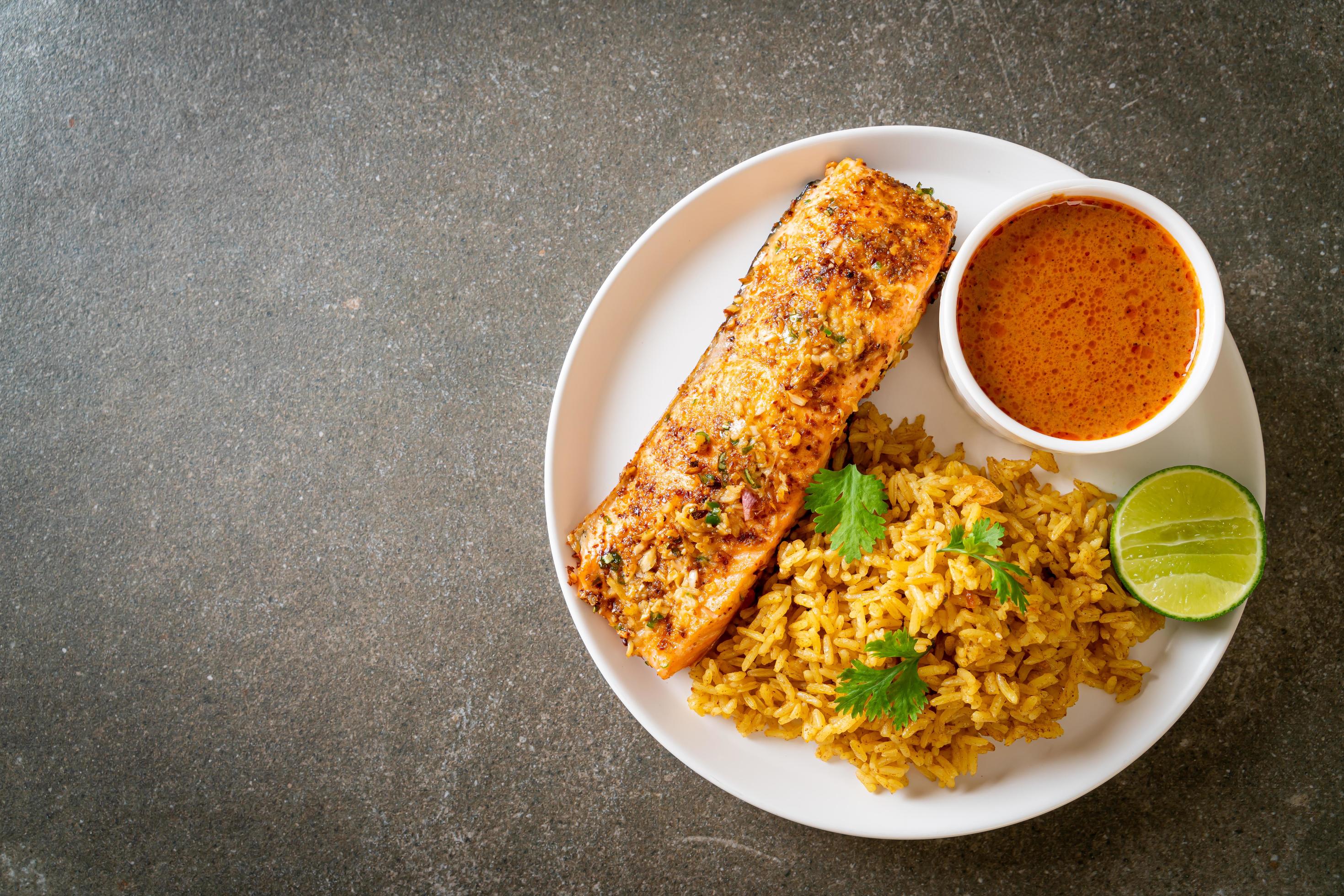 Pan-seared salmon tandoori with masala rice – Muslim food style Stock Free