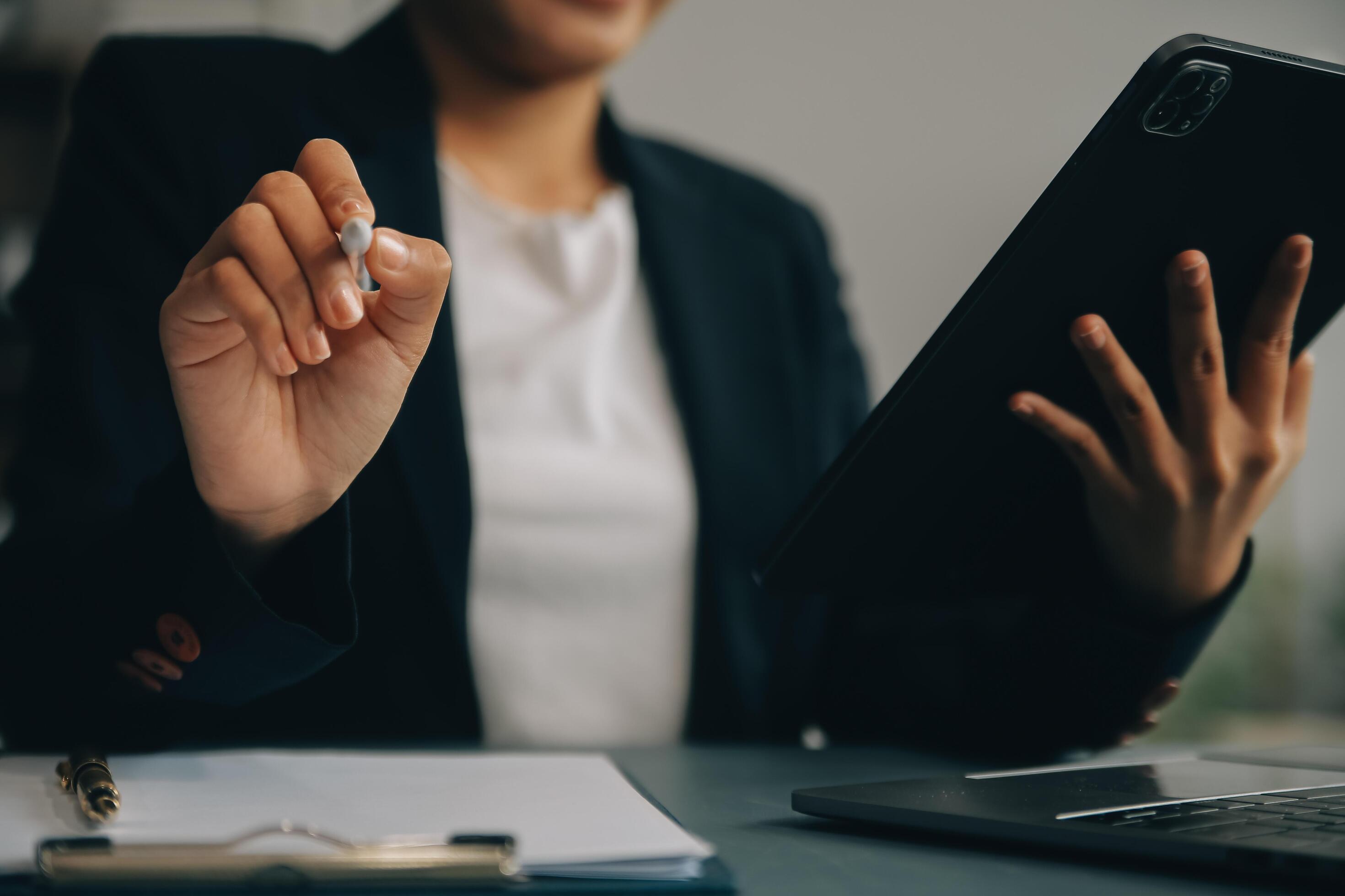 Portrait of a successful business woman using digital tablet Stock Free