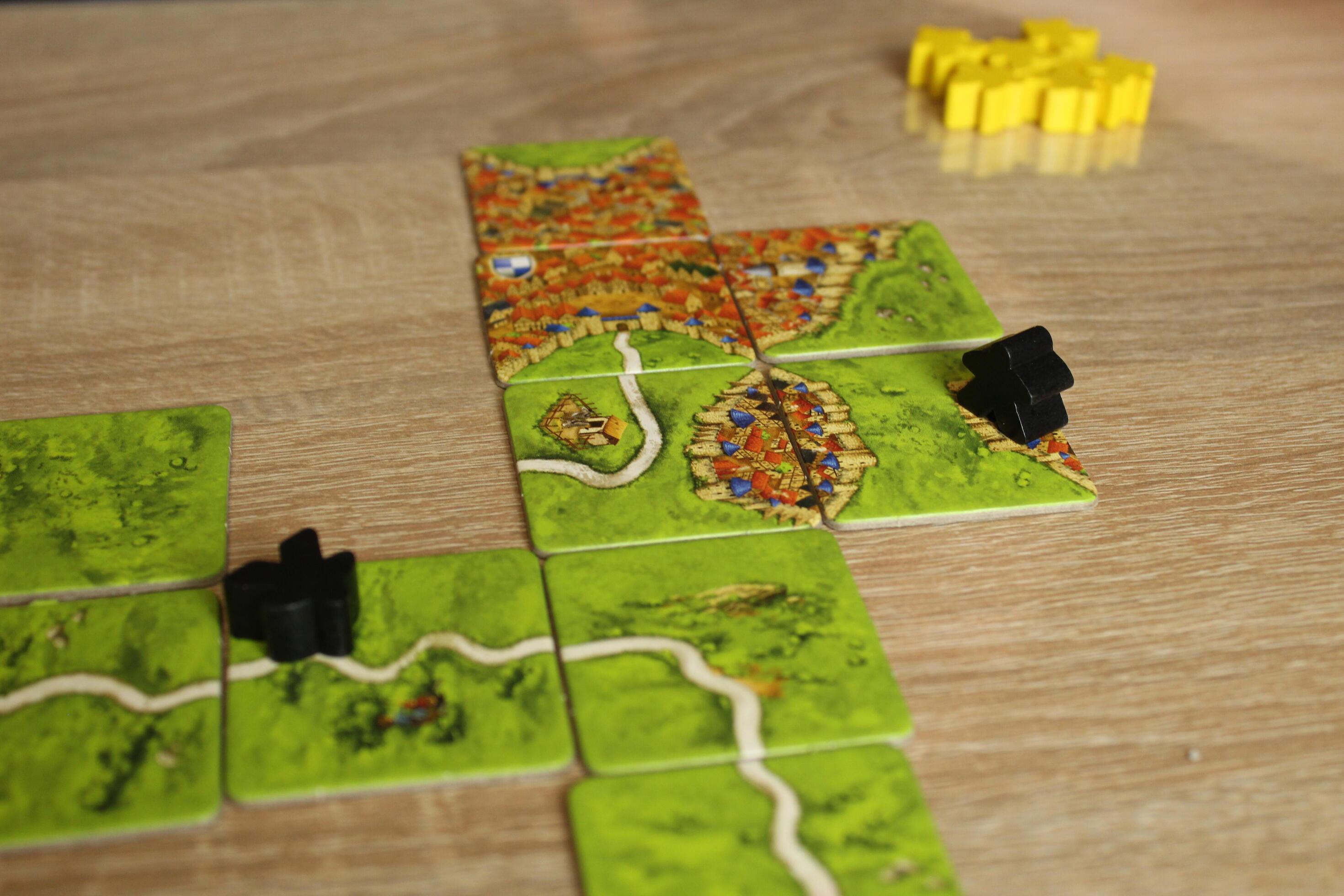 board family game carcassonne. Field with black meeples on the field road. Player Scoring Rule Stock Free