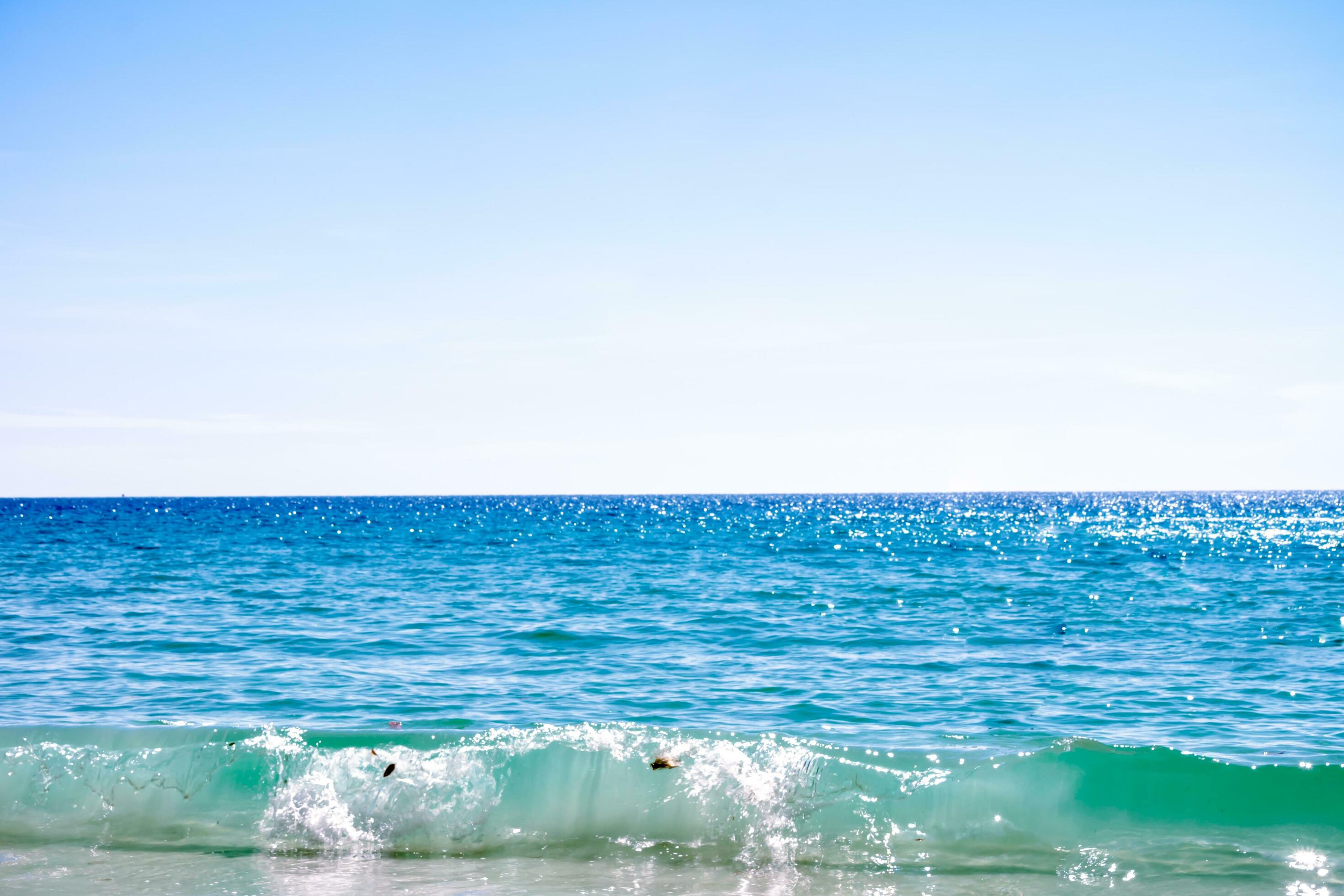 Blue sea surface with waves texture and sky on nature background as summer Stock Free