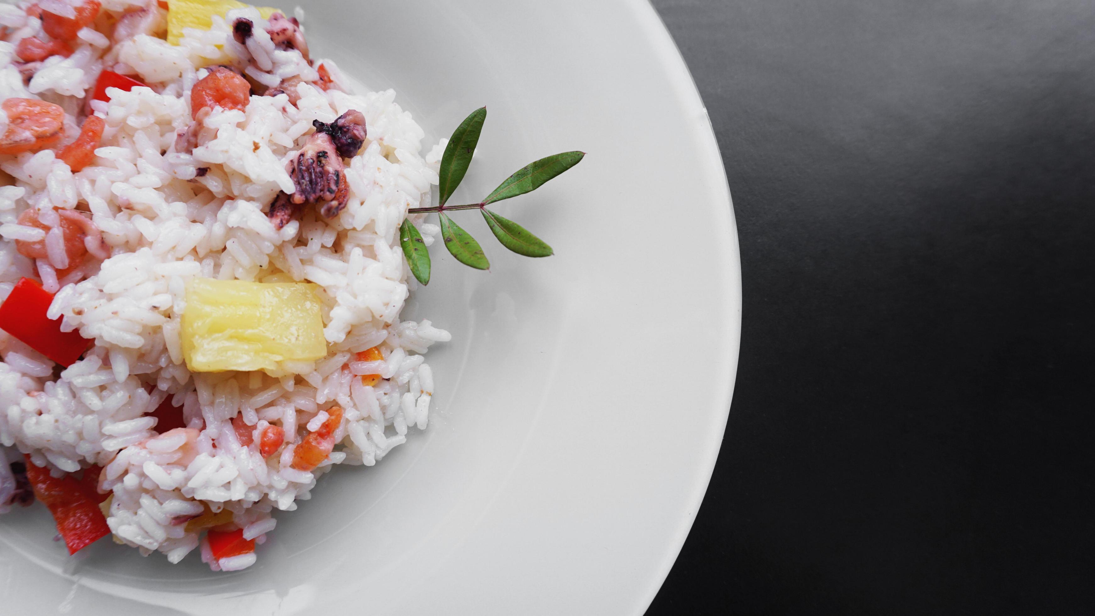 Rice with with shrimp and pineapple, thai food on white dish Stock Free