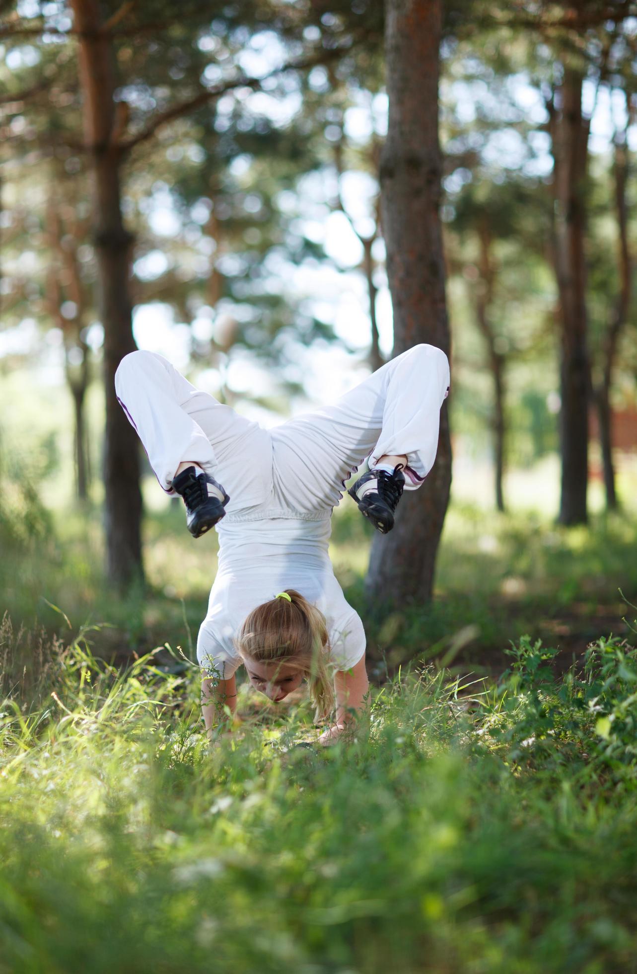 Woman in an asana pose in the forest Stock Free