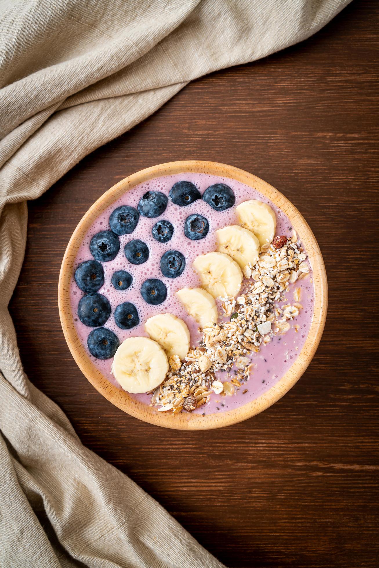 Yogurt or smoothie bowl with blueberry, banana, and granola – Healthy food style Stock Free